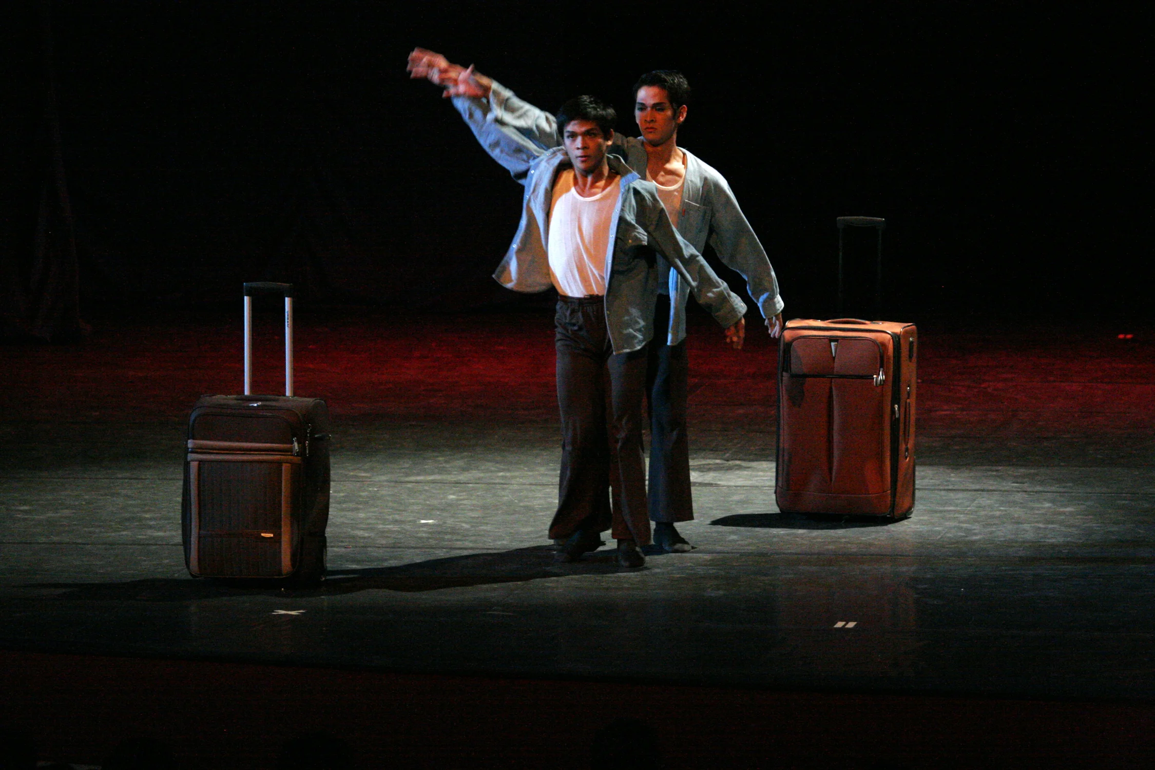 Blue-collar apparel and luggage are the visual cues used to highlight the theme. Photo by Ocs Alvarez