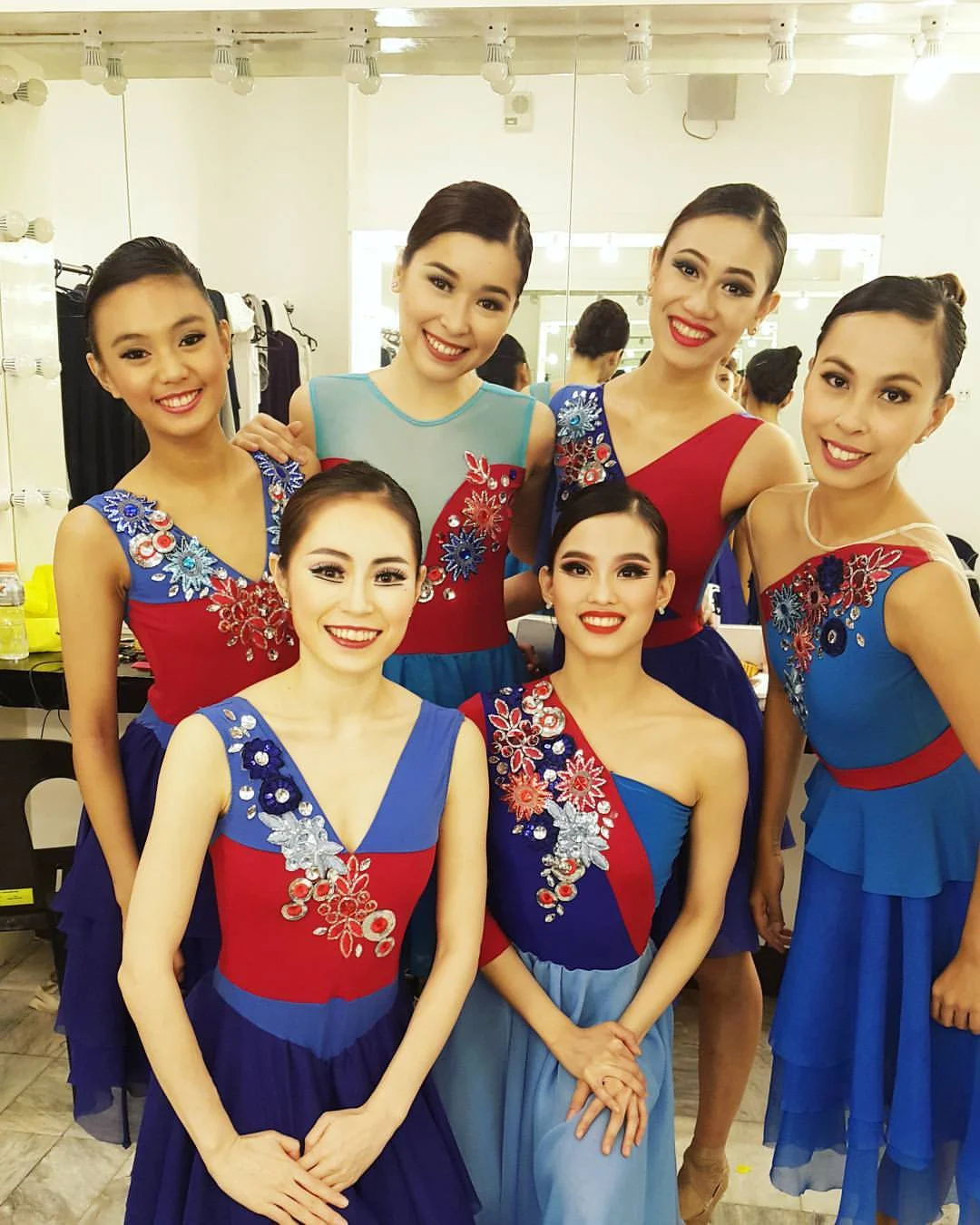 In some performances of Rebel , Abi (standing, third from left) was one of Imelda's Blue Ladies, along with (standing, from left) Henrietta Garcia, Marika Añonuevo, Czarina Villegas, (kneeling, from left) DoHyun Choi and Joan Emery Sia. Photo from Joan Sia's Facebook page