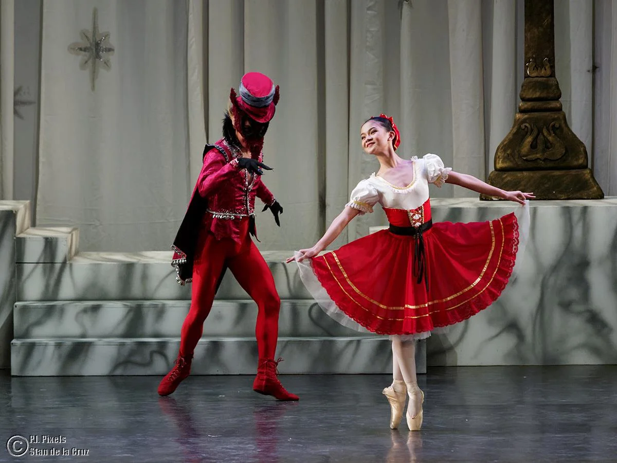 As Red Riding Hood in The Sleeping Beauty , featured in The Swan, The Fairy and the Princess , opposite John Balagot as the Wolf. Photo by Stan de la Cruz