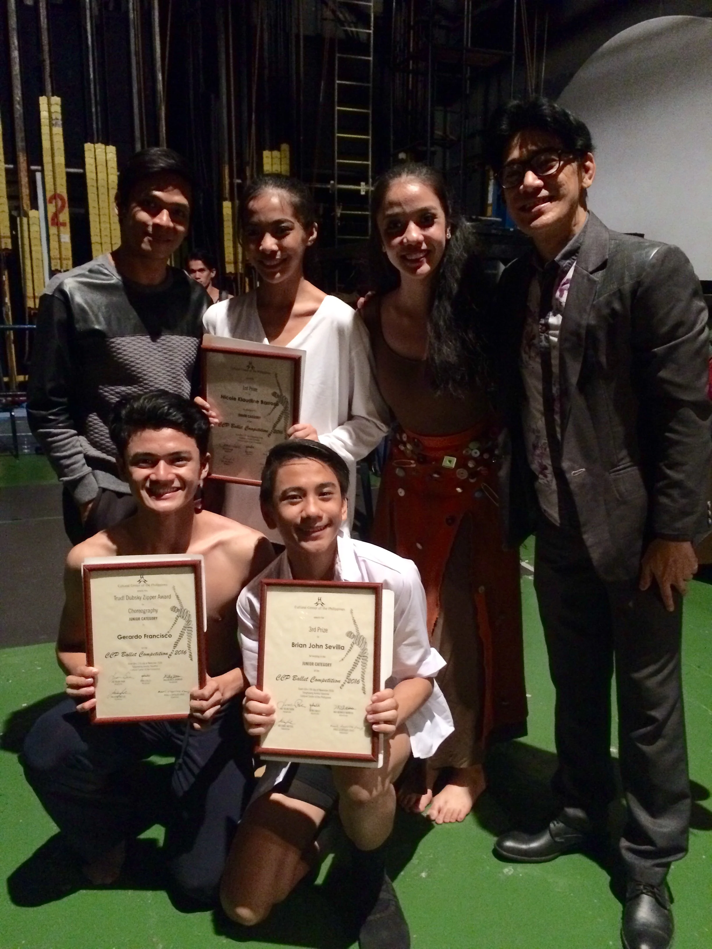 Ballet Manila co-artistic director Osias Barroso (standing, rightmost) congratulates the winners and special awardees backstage: (standing, from left) Gerardo Francisco, Nicole Barroso, Marinette Franco, (kneeling, from left) Joshua Enciso and Brian Sevilla. Photo by Giselle Kasilag