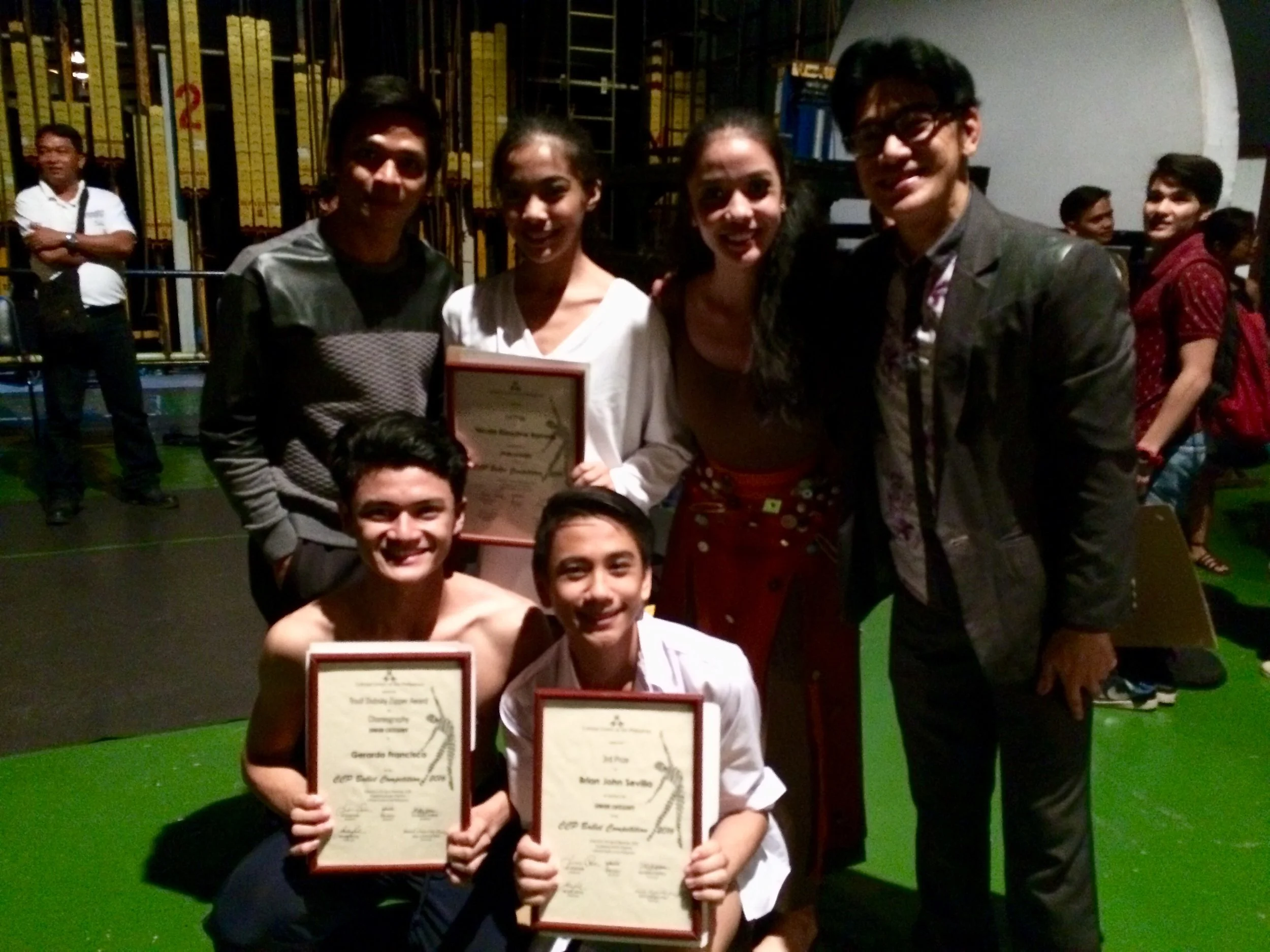 Nicole (standing, second from left) celebrates her win with her uncle and Ballet Manila co-artistic director Osias Barroso (standing, rightmost) and colleagues (standing, from left) Gerardo Francisco, Marinette Franco, (kneeling, from left) Joshua Enciso and Brian Sevilla. Photo by Giselle P. Kasilag