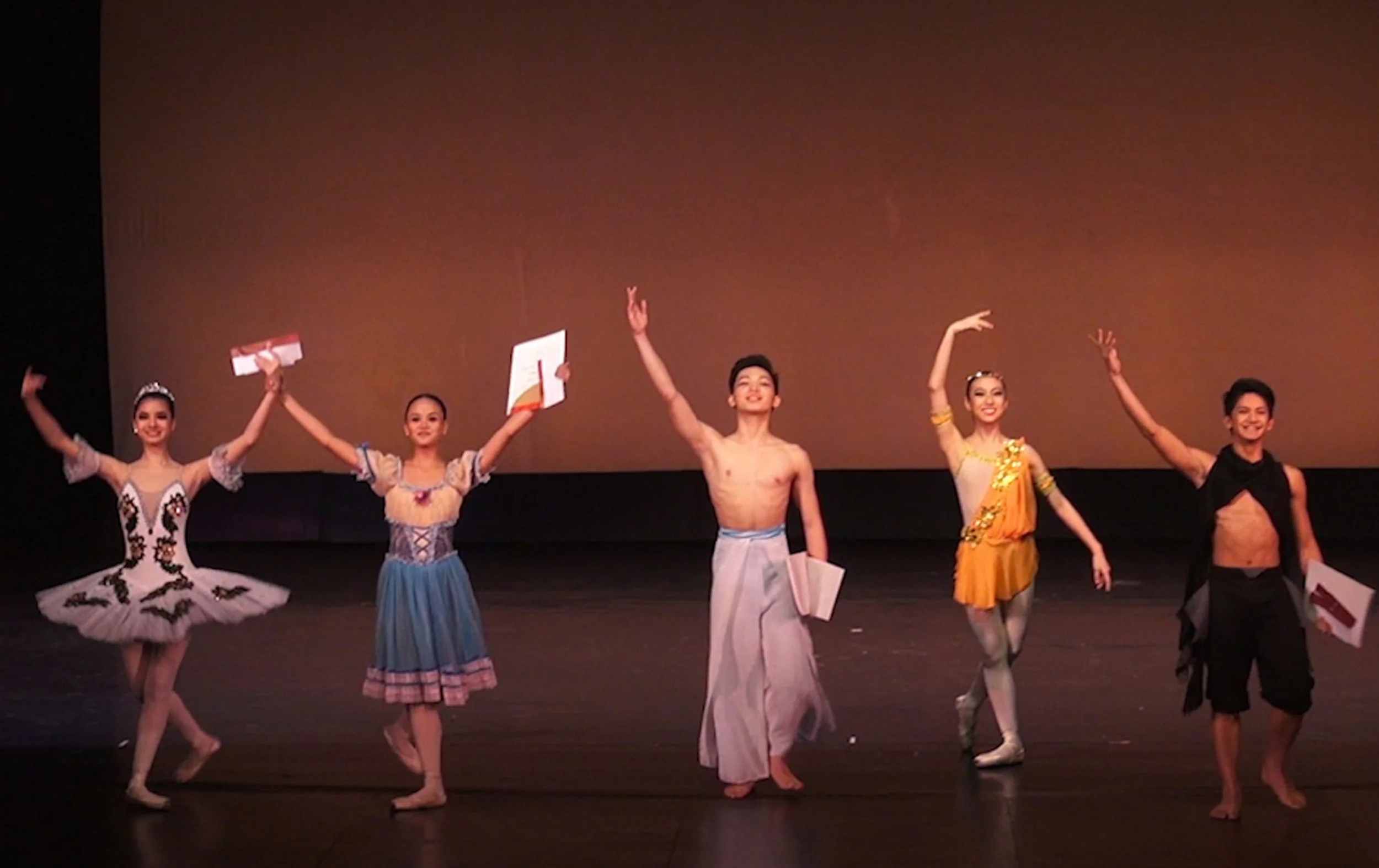 After winning the third prize in the Junior Category of the CCP Ballet Competition in 2014, Rissa May (second from left) celebrated by eating fried chicken.