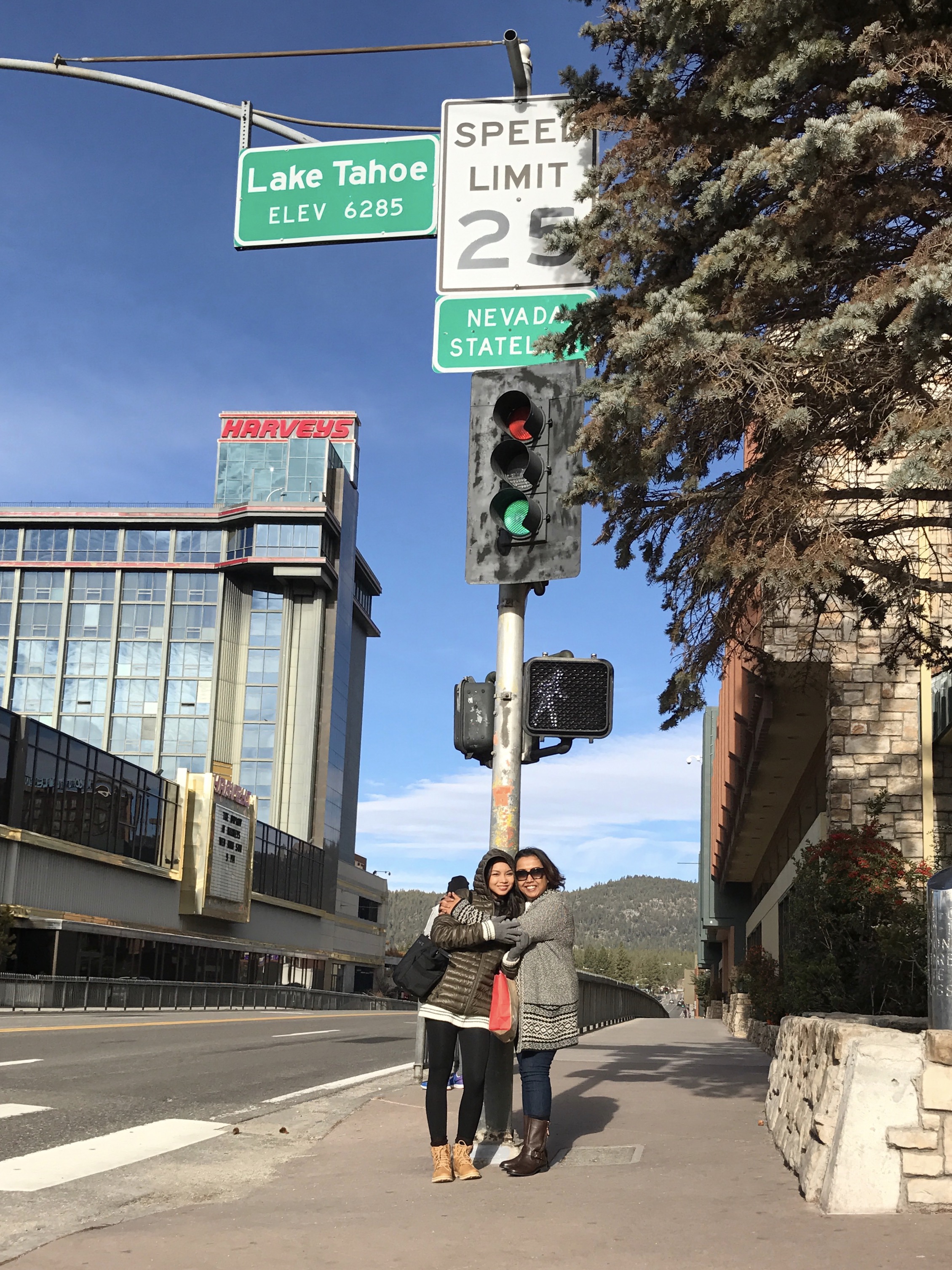  With my half-sister below the Nevada Stateline sign 
