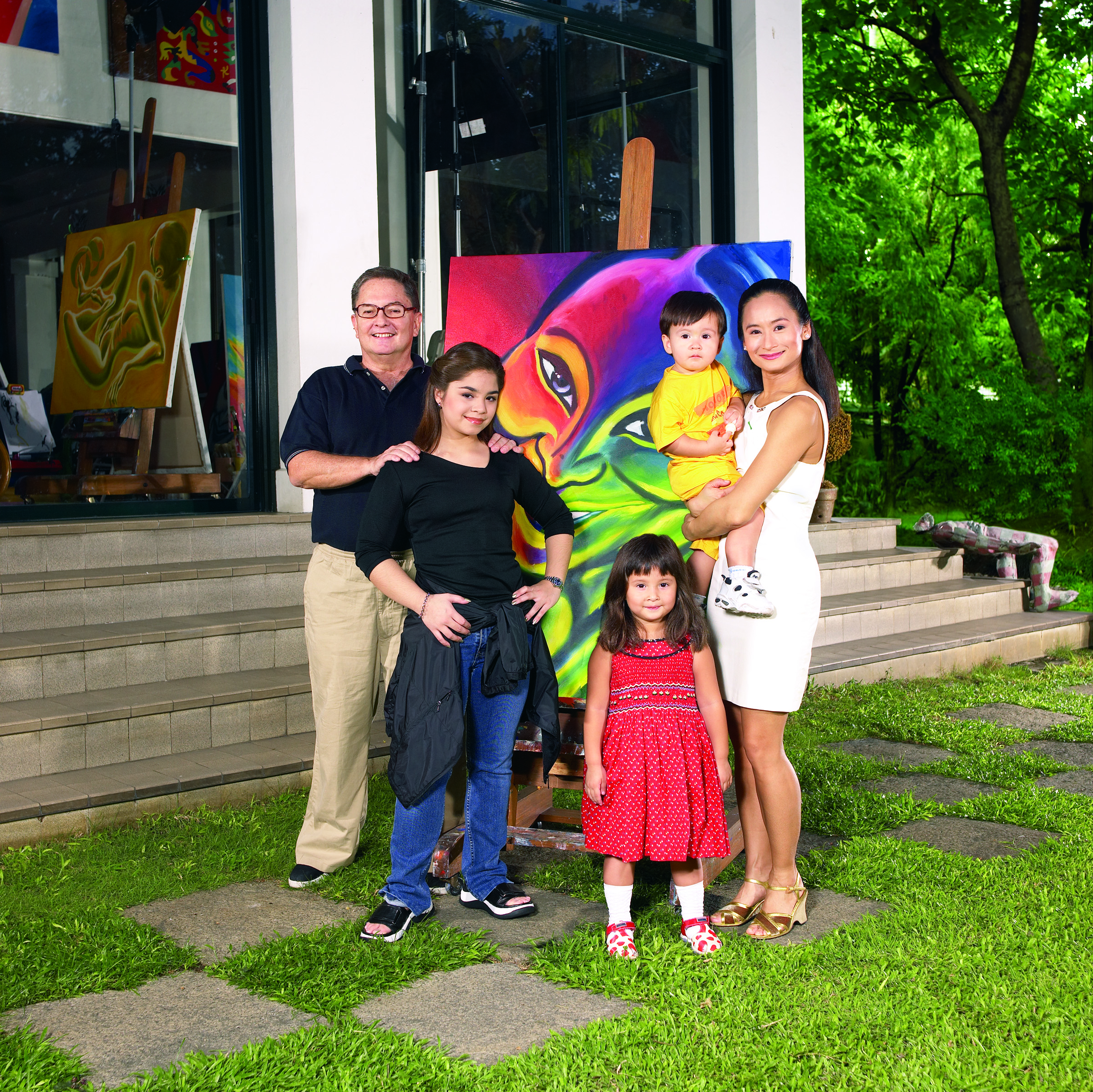 Fred has painted many works depicting Lisa, including the one shown in this family photo taken in 2002. With the couple are their children Sasha, Missy and Manuel.