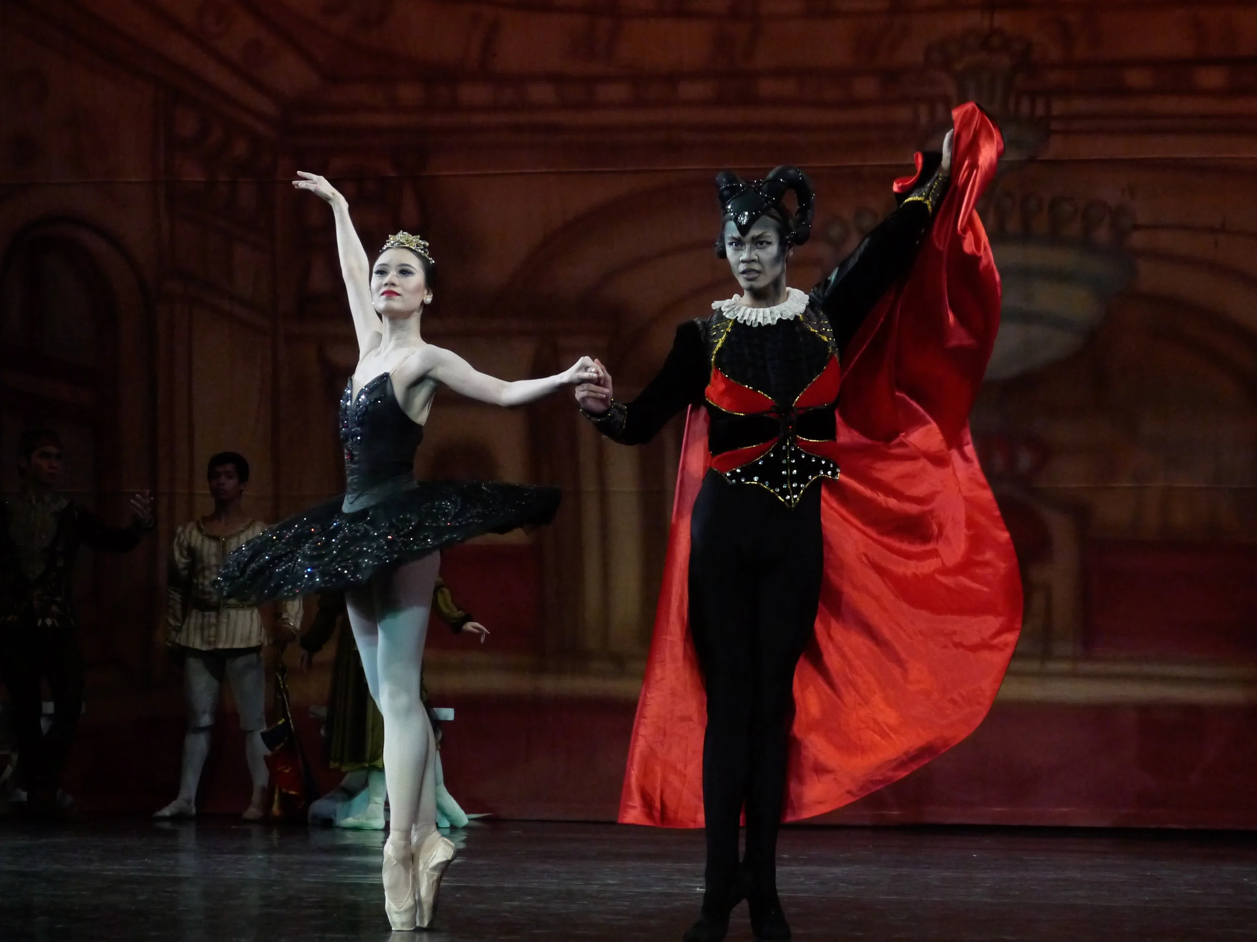 Abi and Godwin make a sinister pair in Swan Lake , she as Odile the Black Swan and he as the sorcerer Von Rothbart. Photo by Giselle P. Kasilag