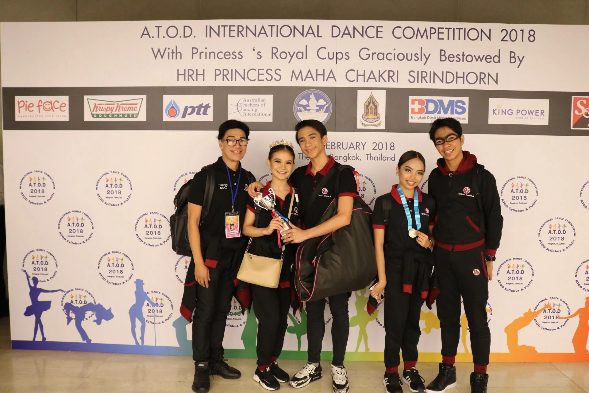 Ballet Manila co-artistic director and delegation coach Osias Barroso (left) celebrates with dancers Shaira Comeros, Brian Sevilla, Elyssabeth Apilado and Alvin Dictado after the ATOD awarding ceremonies.
