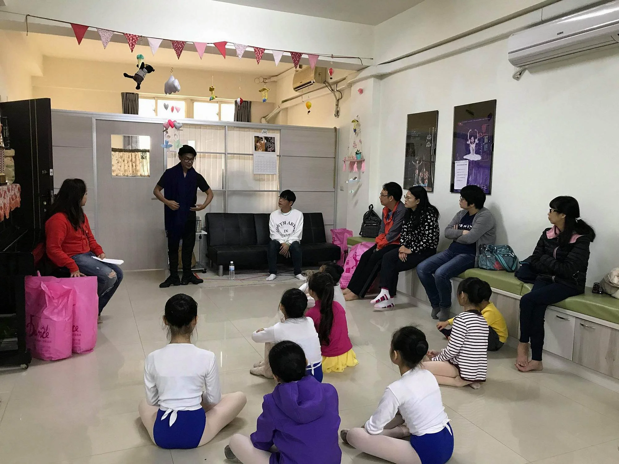 Ballet Manila co-artistic director Osias Barroso conducts one of the classes, as some parents also listen in, at the Zhongli Youth Ballet.