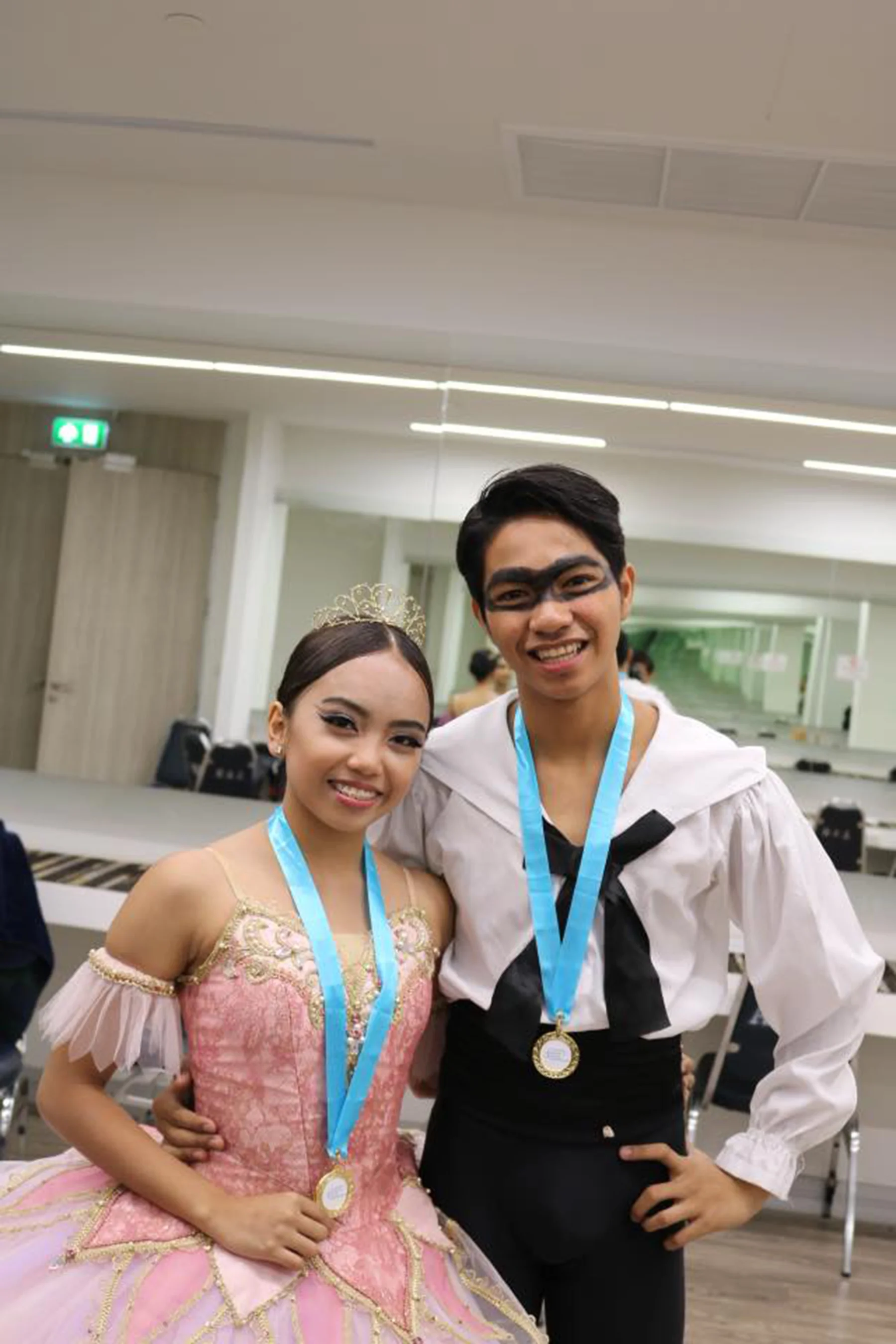 Elyssabeth Apilado and Alvin Dictado wear their Honorable Mention medals for their Harlequinade pas de deux at the 2018 ATOD Competition.