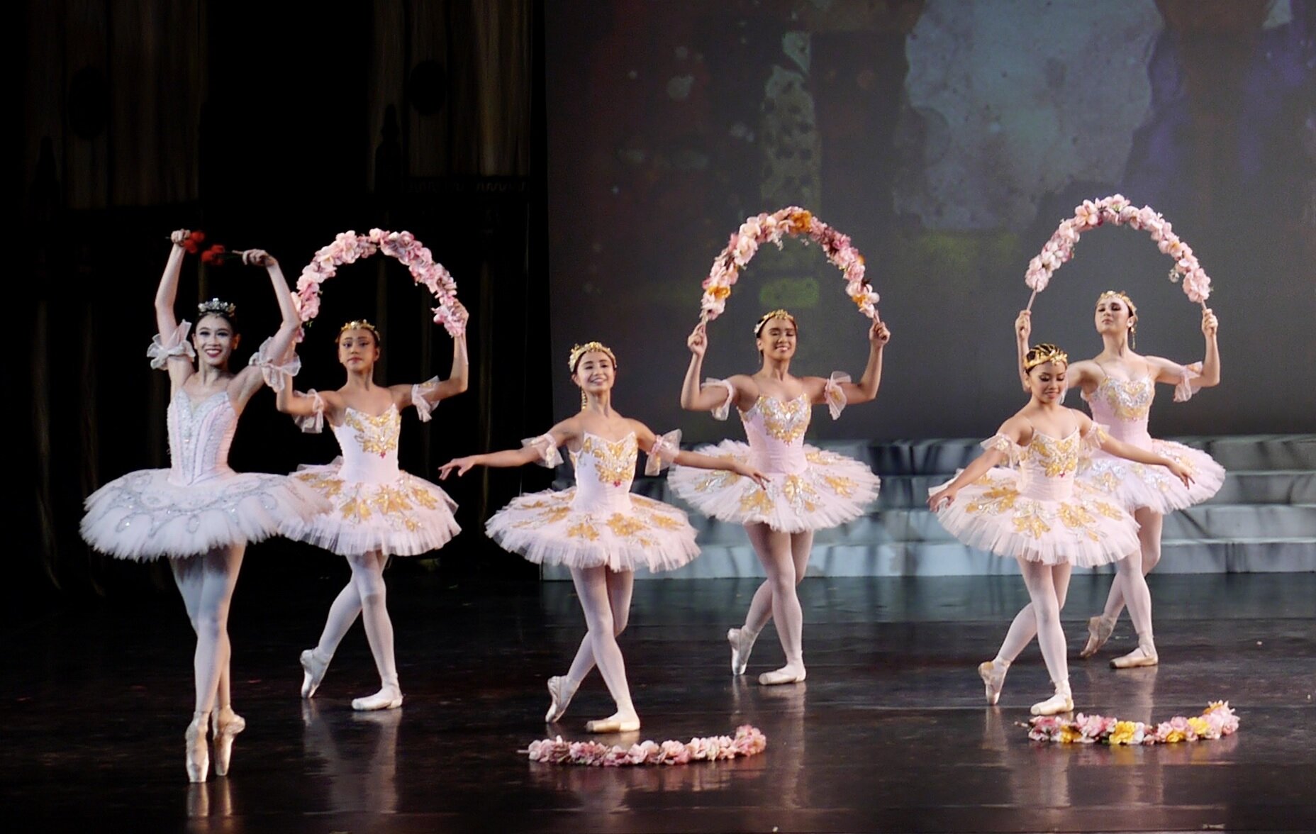    Everything’s coming up roses for Medora (Abigail Oliveiro, leftmost) as she leads the ballerinas in the dreamy Living Garden sequence in the pirate adventure  Le Corsaire  (2018). Their blush pink tutus lend an even more enchanting touch to the sc