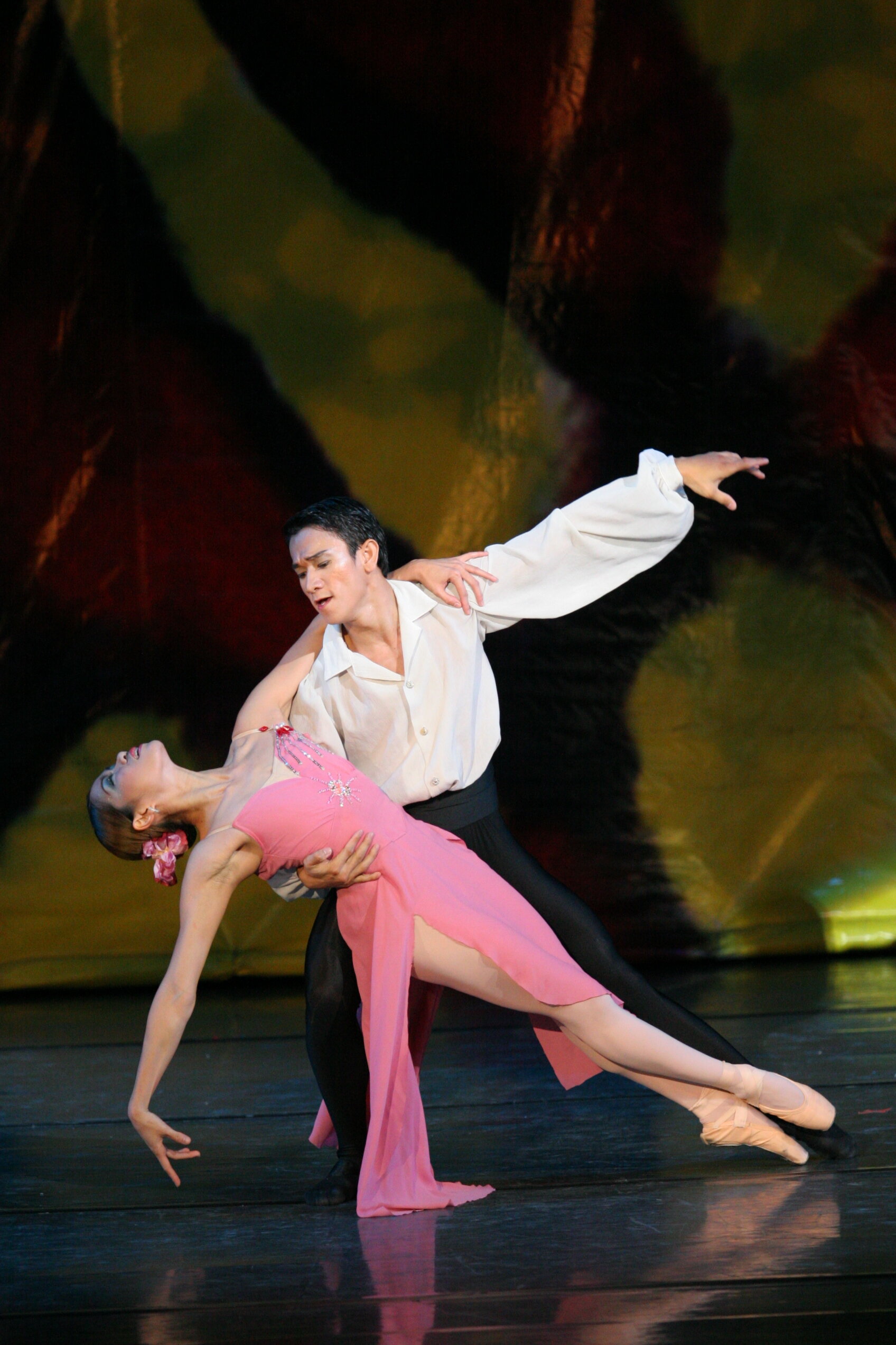    Sandralynn Huang in pink and Jerome Espejo in black and white figure in a passionate pas de deux for  BM Goes International  (2015), a preview of numbers to be performed by Ballet Manila in shows and competitions abroad that year. Photo by Ocs Alv