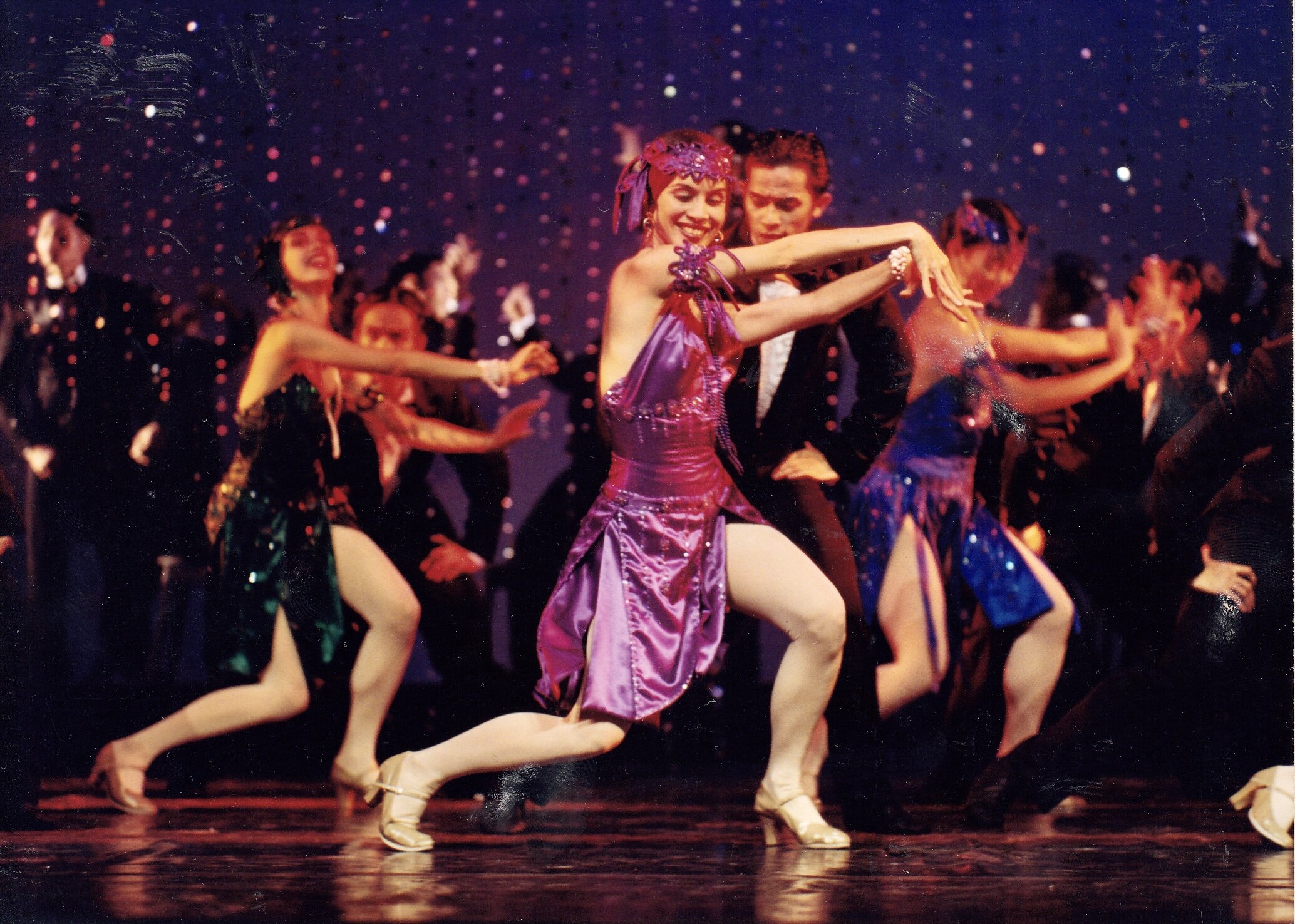    A plum dress to match a plum role. Melanie Motus is part of a rare ballet number set in the Roaring Twenties. This is  Sugar-Step Elizalde , choreographed by Tony Fabella and using the music of the irrepressible maestro, Federico “Fred” Elizalde, 