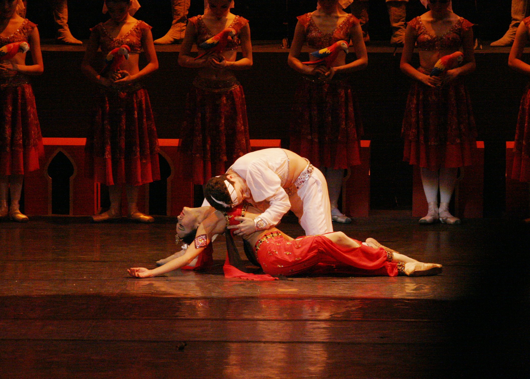    Solor (Maxim Chashchegorov) swears eternal love to the temple dancer Nikiya (Lisa Macuja-Elizalde) before the sacred flame in  La Bayadere  (2004). But unknown to her, he is already committed to Gamzatti. Upon learning of Nikiya, Gamzatti plots wi