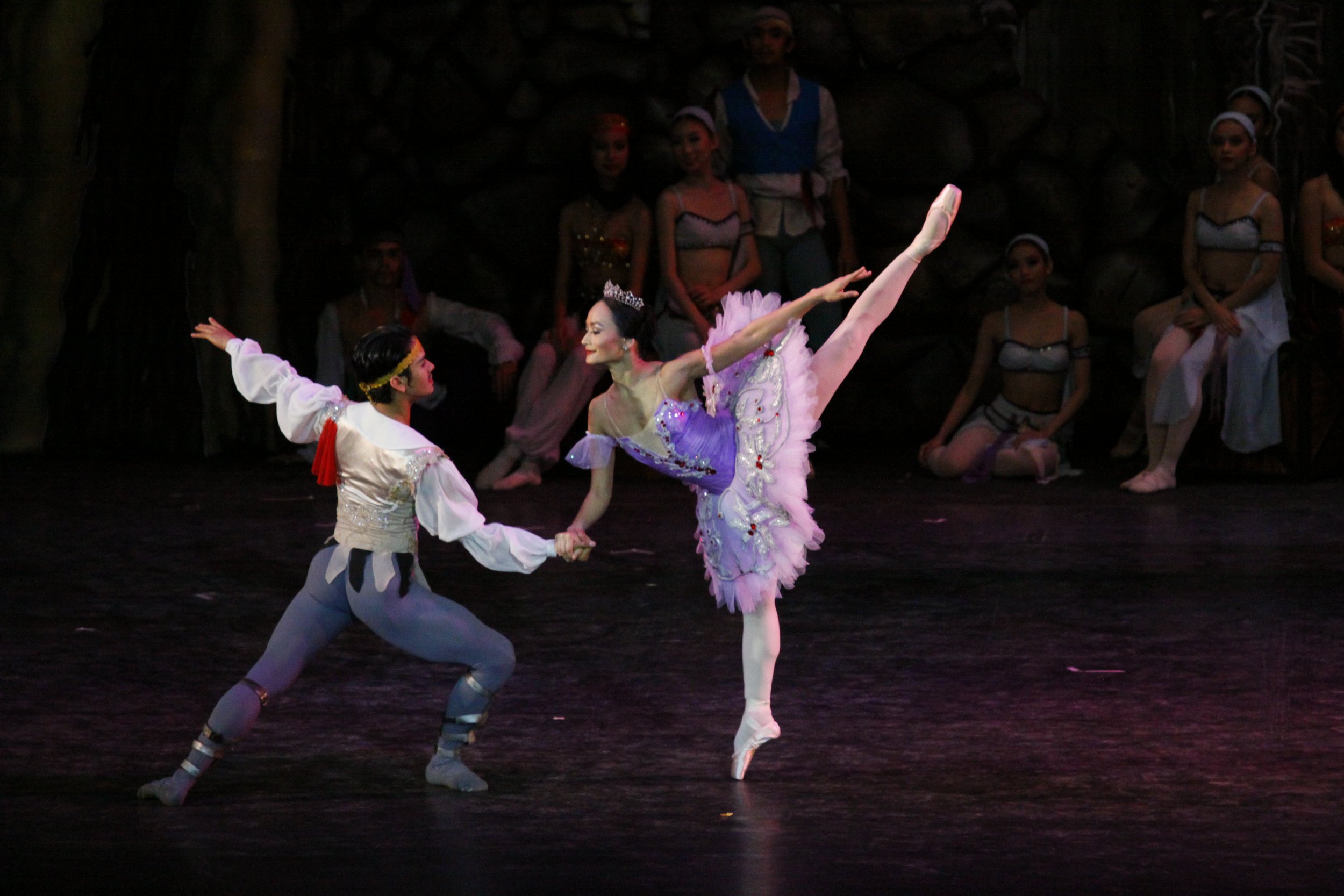    Lisa Macuja-Elizalde is a vision in violet as the perennially-in-peril Medora while Rudy De Dios is the dashing pirate Conrad always ready to save her in  Le Corsaire  (2013). Photo by Ocs Alvarez   