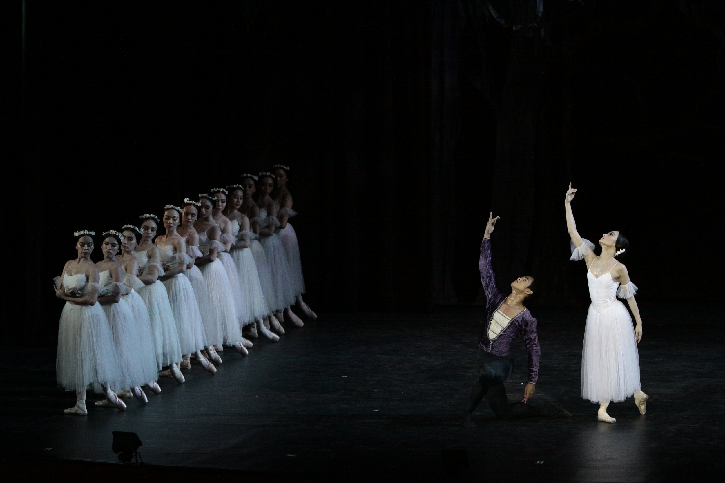    Rudy De Dios as Prince Sigfried wears finery in eggplant color, a stark contrast to the white worn by Giselle (Lisa Macuja-Elizalde) and the rest of the wilis – jilted women turned spirits – in the classic  Giselle  (2010). Photo by Ocs Alvarez   