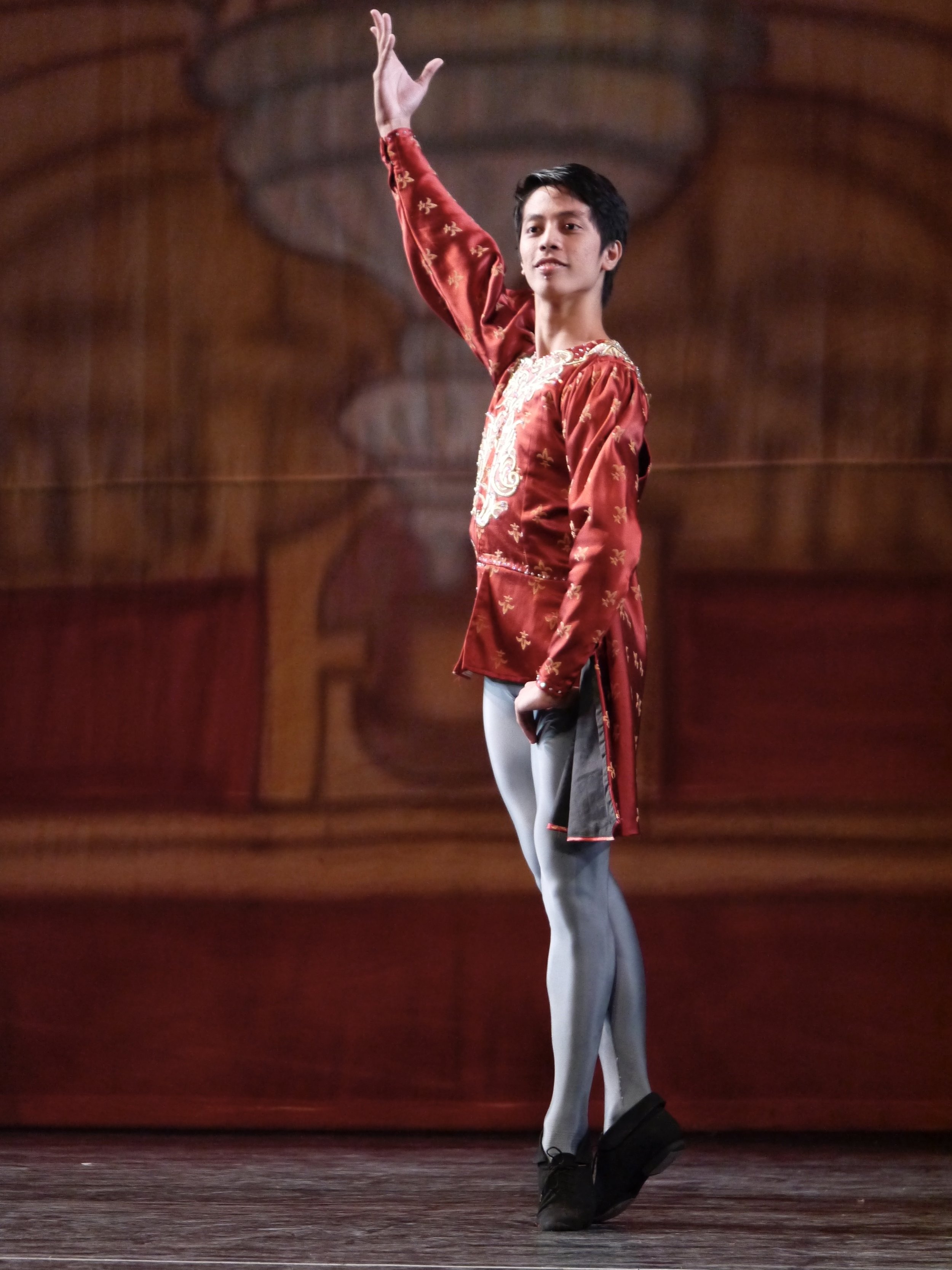    Dancing as one of the cavaliers in  Swan Lake  (2017), Rodney Catubay reflects dignified elegance in red and gray. Photo by Giselle P. Kasilag   