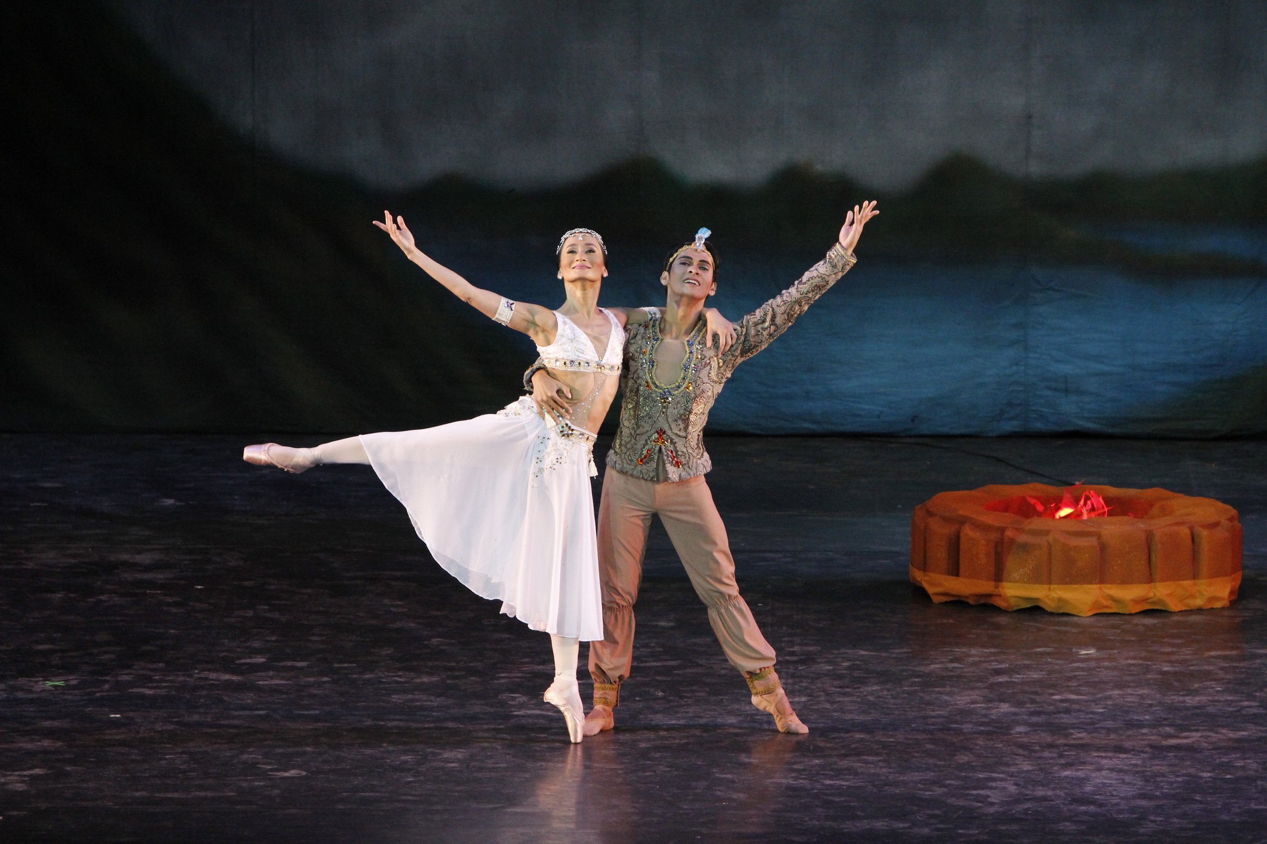    Nikiya (Lisa Macuja-Elizalde) and Solor (Rudy De Dios) swear their eternal love for each other by the sacred fire in  La Bayadere  (2013). Their costumes reflect an Indian fashion sensibility, she in white and he in taupe, both bearing accents of 