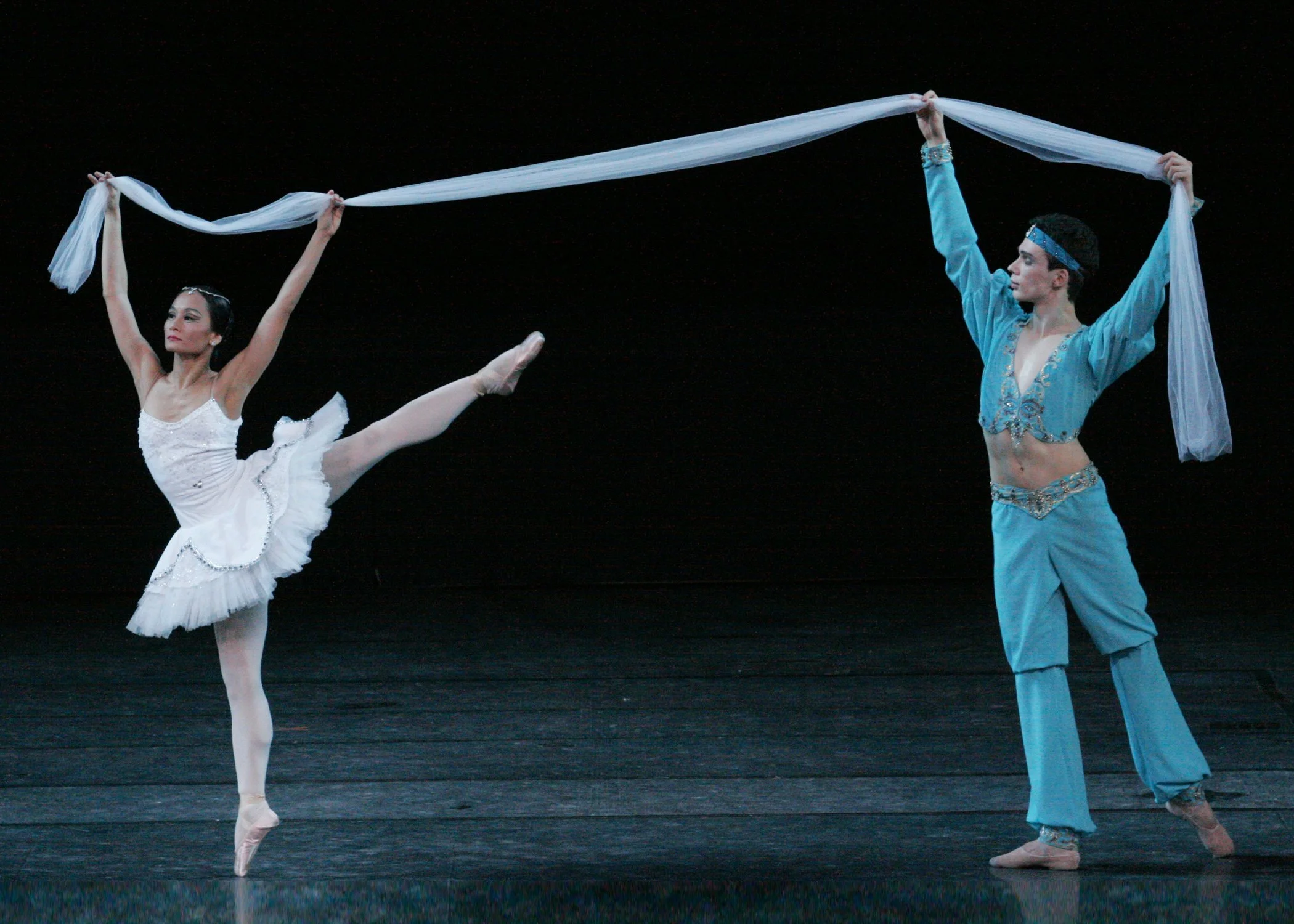    Maxim Chaschegorov guests again as Solor, 2006. “There is another exotic choreography known as the ‘Scarf Dance’ where the bayadere dances with a scarf that is held by the prince. It takes a lot of balance and control because the ballerina must gi