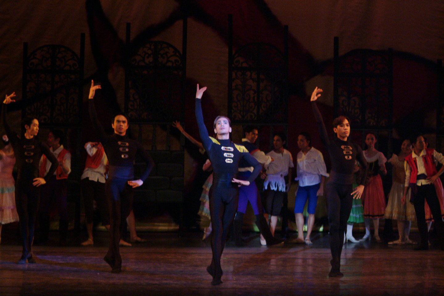    As the gallant soldier Don Jose, Osias Barroso (third from left) leads his men in a scene from Eric V. Cruz’s  Carmen . All wearing black uniform, they exude an air of refined elegance that goes perfectly well with their impeccable rhythm. Photo b