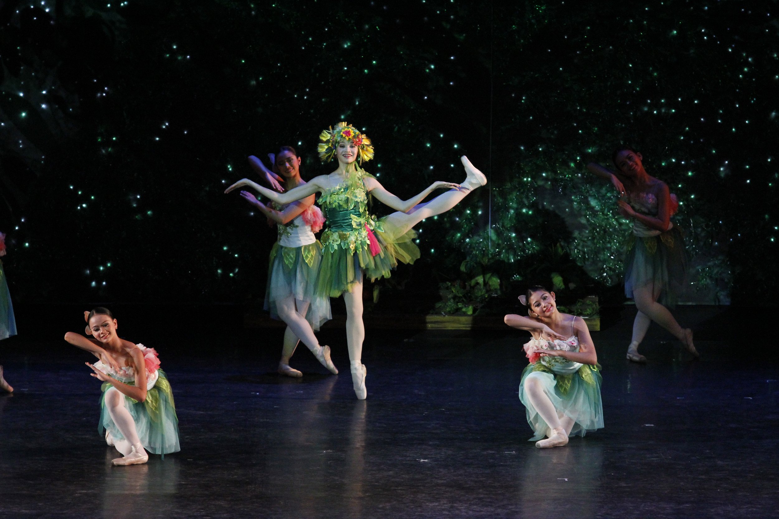    In Hazel Sabas-Gower’s  Sinderela  (2012), the fairy Tiera (Dawna Reign Mangahas) and her garden spirits reflect the color and bounty of nature with their flower and leaf-accented green tutus and hair ornaments. Photo by Ocs Alvarez   