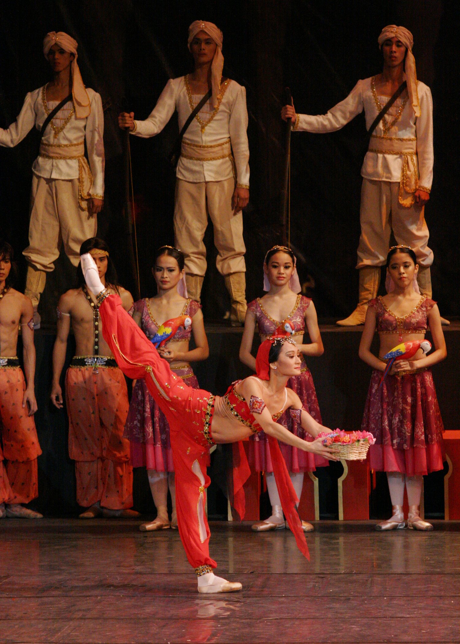    The temple dancer Nikiya (Lisa Macuja-Elizalde) in  La Bayadere  (2004) performs at the engagement of her love Solor to Gamzatti, not knowing that the latter has conspired to have a poisonous snake placed in the basket of flowers she is holding. P