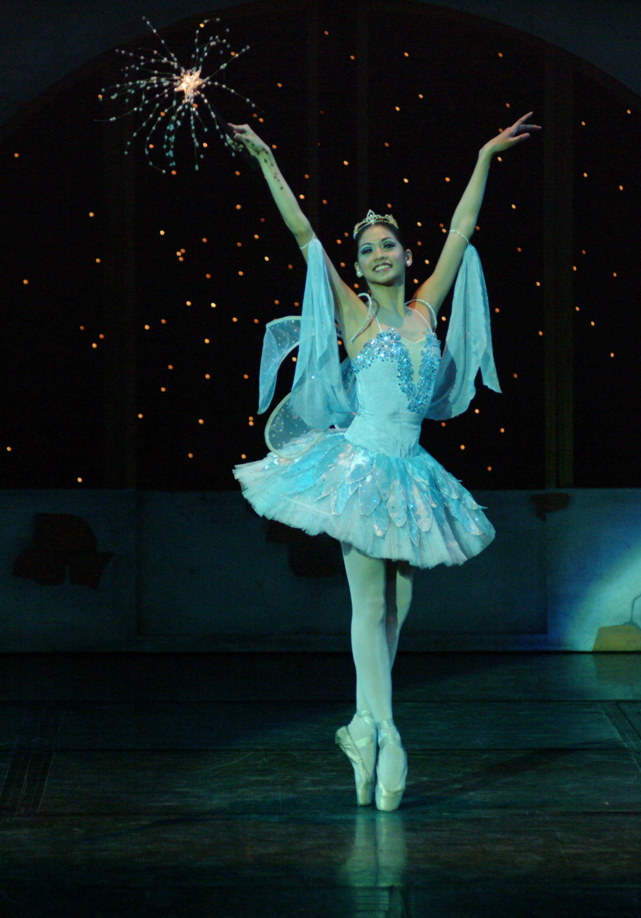   The Blue Fairy (Christine Rocas) adds a touch of enchantment to  Pinocchio , adapted into ballet by Osias Barroso (2004). Wearing a blue tutu and holding her magic wand, she symbolizes love and kindness as she reminds the puppet Pinocchio to alway