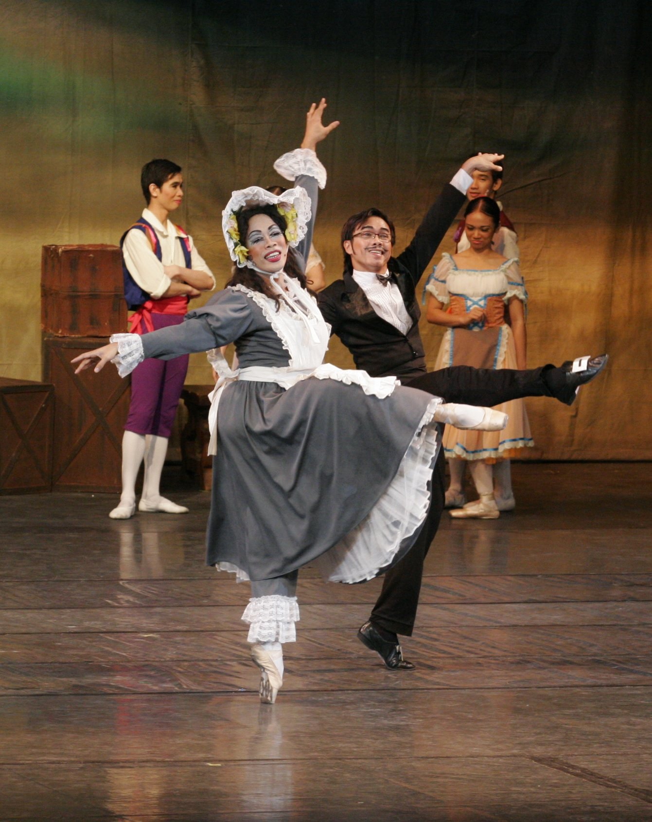    The flirtatious Widow Simone (Jonathan Janolo) and the seemingly enamored Thomas (Marcus Tolentino) go toe to toe in  La Fille Mal Gardee  (2008). The scene is made hilarious as Simone – usually played by a danseur – gives her all to attract the w