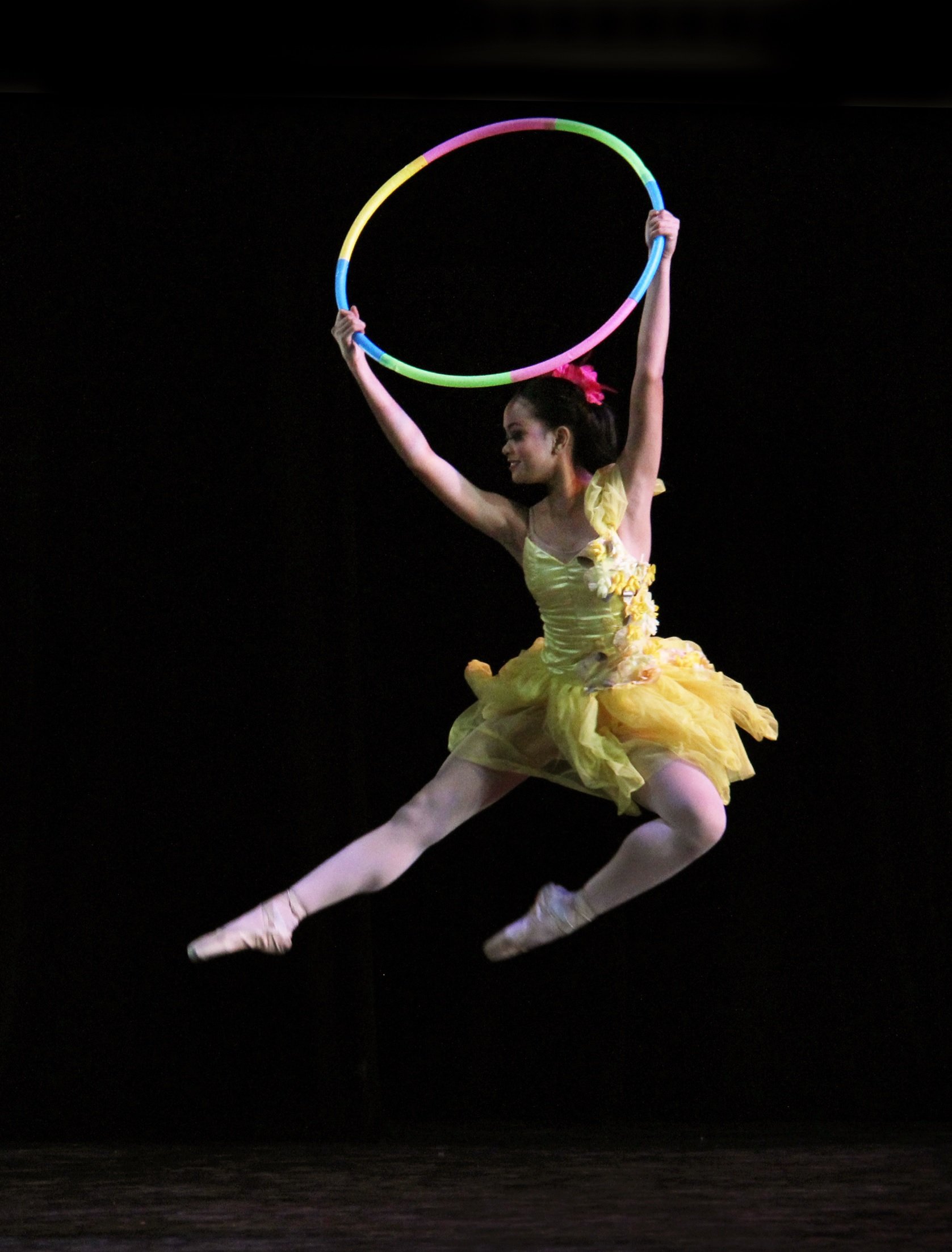    With a tutu as cheerful as this one worn by Rissa May Camaclang, how can the season not be merry and bright? Yellow tutu and neon hula hoop make a splash in the Christmas production  Nutkraker  (2014). Photo by Daniel Trinidad   