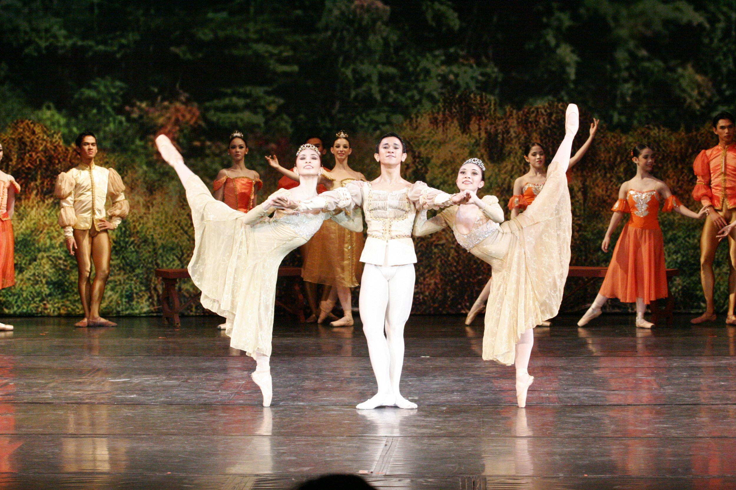    Marian Faustino, Jerome Espejo and Mylene Aggabao are three of a kind in  Swan Lake  (2005) as they dance the Pas de Trois wearing matching outfits in beige. The muted tone uncharacteristically makes them stand out amid the sea of orange behind th