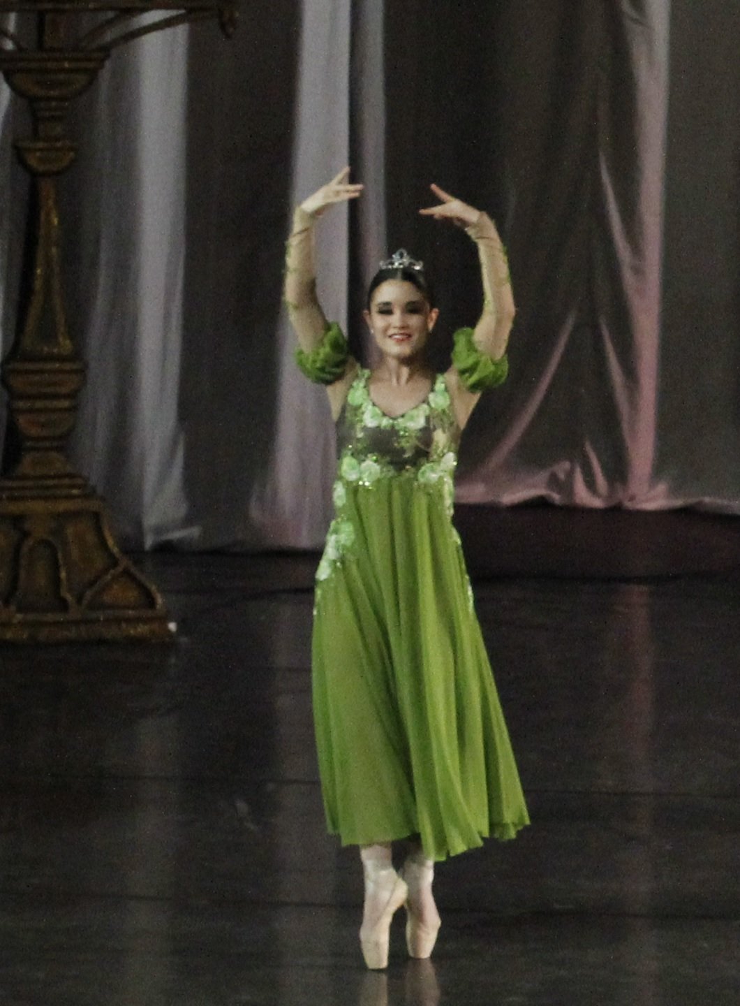    Tiffany Chiang-Janolo looks every inch the dainty princess as she wears an olive green frock with floral appliques and glittery beads. She danced as one of the royal daughters in  Labindalawang Masasayang Prinsesa , one of tales showcased in  Tatl