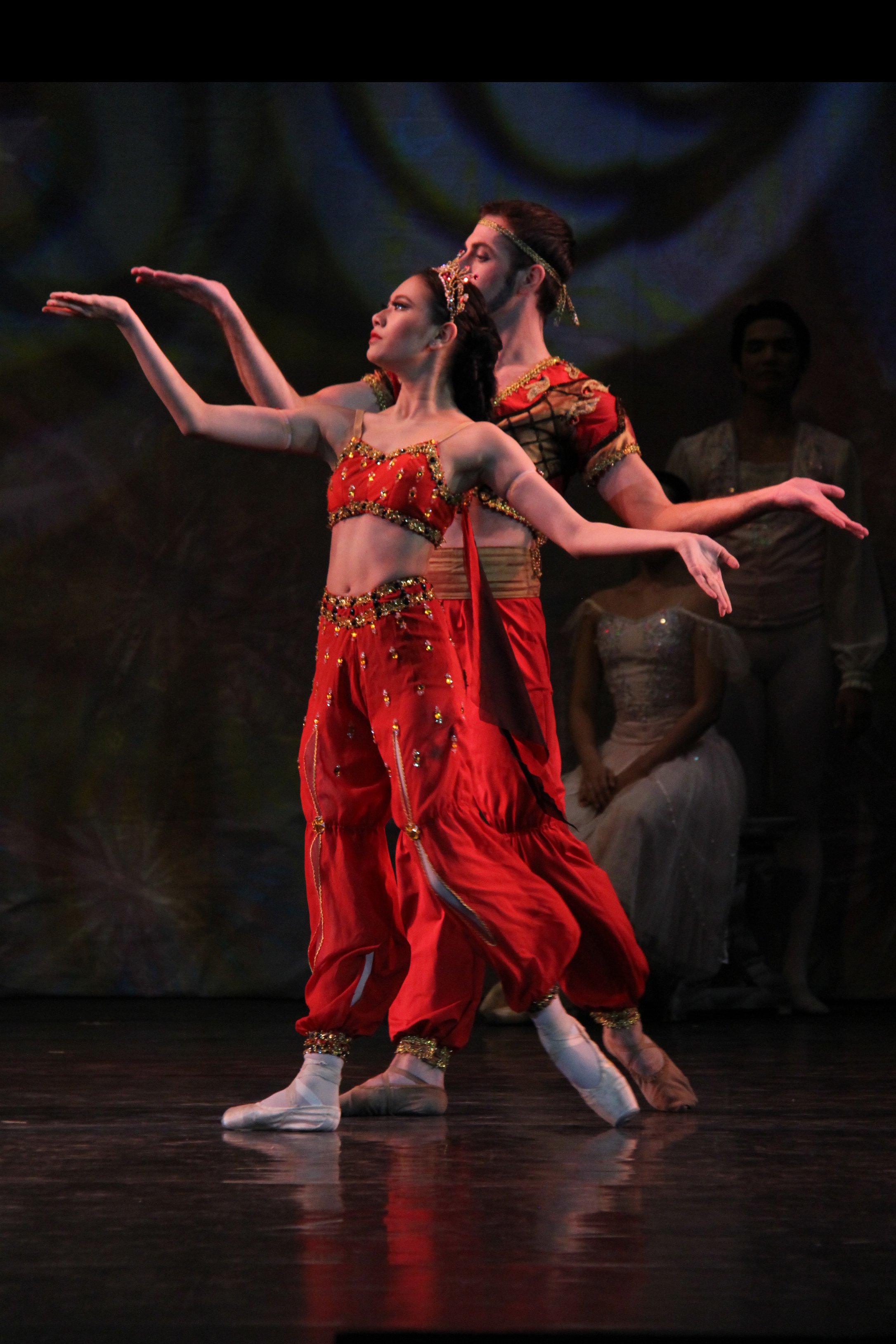    Dancing to exotic strains, Abigail Oliveiro and Brian Williamson are featured in the Arabian Dance. They represent coffee which has been cultivated in the Middle East for centuries, and in their movements, channel its unmistakably robust aroma.   