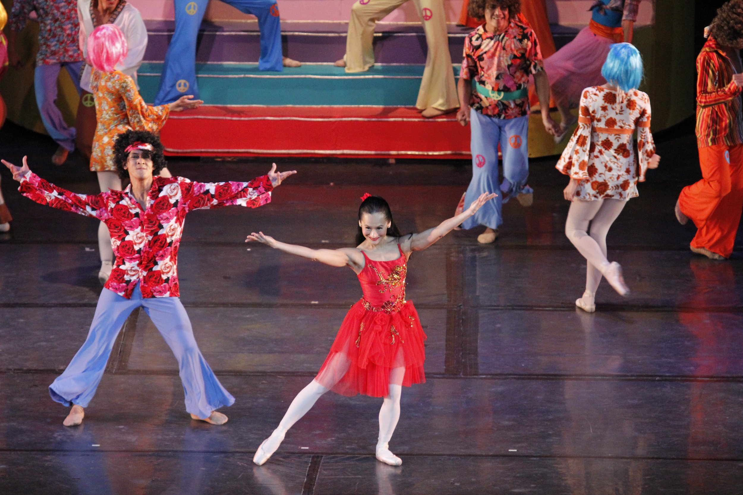    Lisa Macuja-Elizalde and Rudy De Dios channel a groovy vibe – he in red floral top and denim bell-bottoms and she in a red tutu with glittery accents – as they dance to the Mamma Mia Medley in  Ballet &amp; Ballads  (2013). Made up of ABBA hits, t