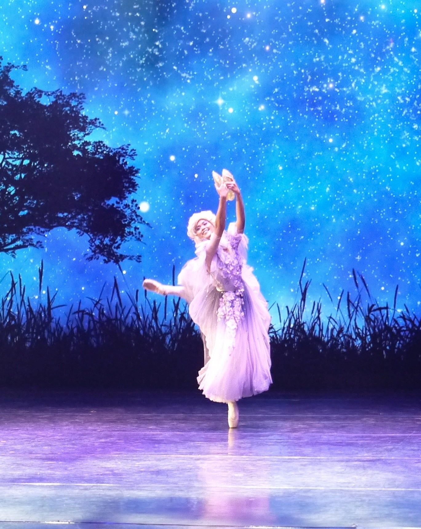    Rissa May Camaclang gets to sprinkle some fairy dust as Fairy Godmother in an excerpt of Lisa Macuja-Elizalde’s  Cinderella , performed at the relaunch of Aliw Theater in August 2022. Wearing a long tutu – in lilac with hints of purple – that flar