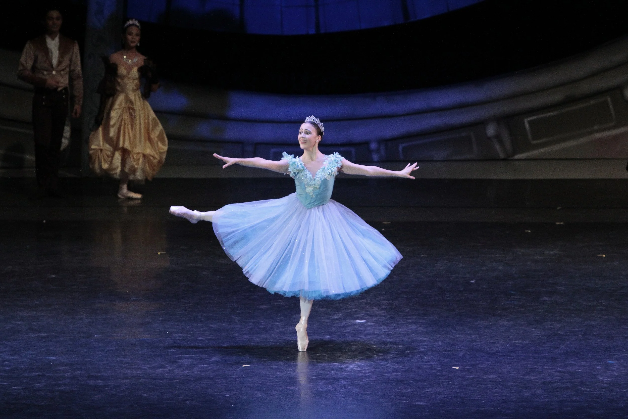    Cinderella (Katherine Barkman) makes quite an entrance in her frilly blue frock at the grand ball, stirring everyone’s curiosity as to her identity. The scene is from Lisa Macuja-Elizalde’s  Cinderella  which premiered in 2016. Photo by Ocs Alvare