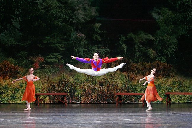    It is Prince Siegfried’s twenty-first birthday, and the revelry is ongoing at the palace in  Swan Lake  (2005). A variety of entertainment fare is offered to guests including a lively number from the Jester (Gerardo Francisco Jr.) who leaps and ju