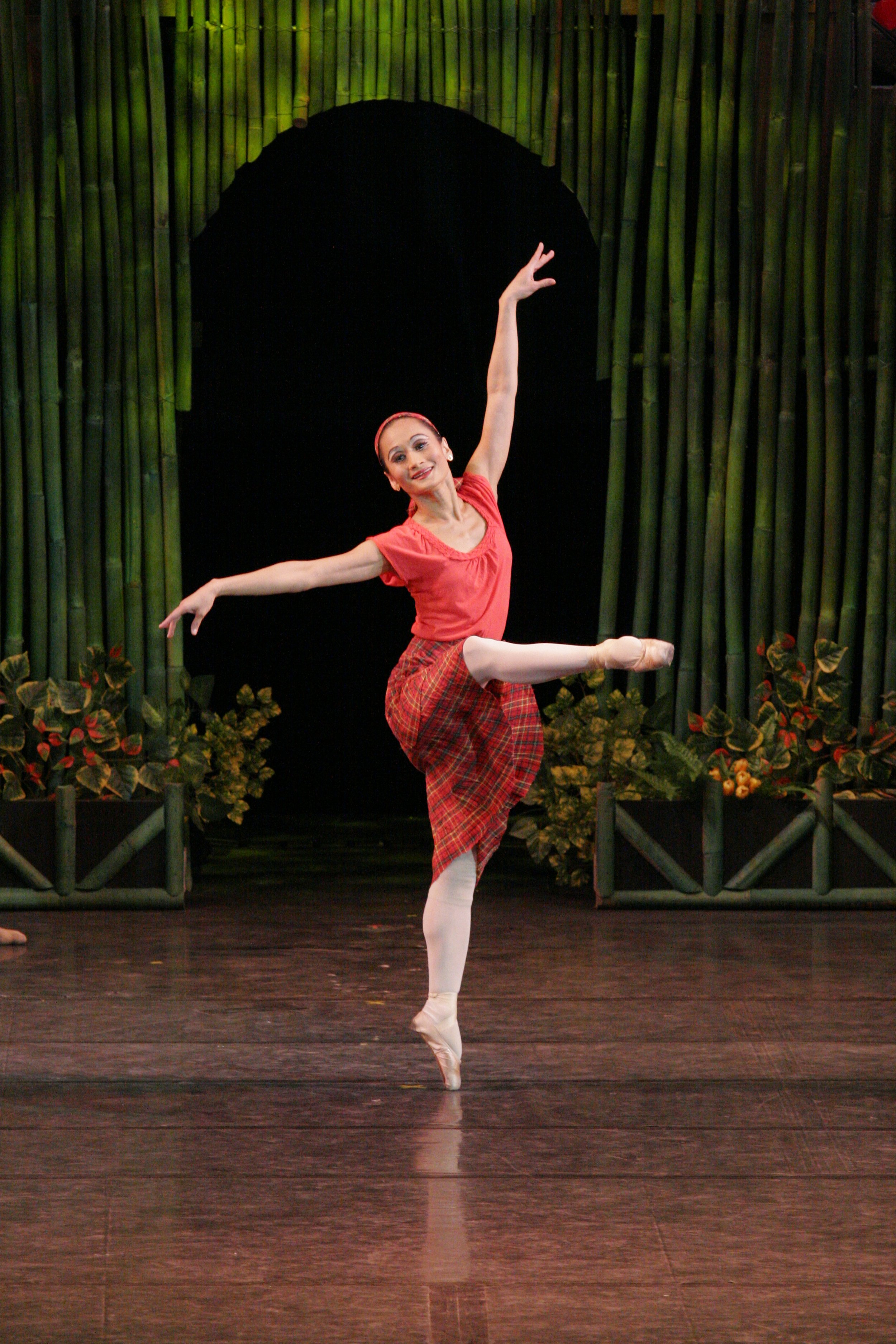    The celebratory spirit of a barrio fiesta &nbsp;is aptly captured in this red ensemble worn by Lisa Macuja Elizalde in her role as a lass being wooed by two rival suitors. Choreographed by Osias Barroso Jr. and Gerardo Francisco Jr.,  Pista  mirro