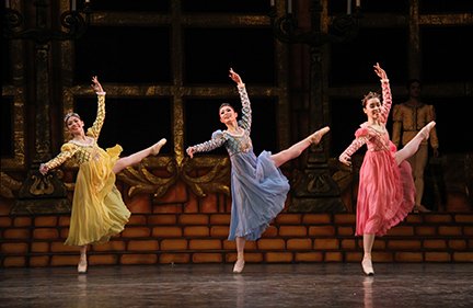    Festivities are underway to celebrate Prince Siegfried’s twenty-first birthday in  Swan Lake  (2014), and these court ladies – attired in attractive jewel tones of yellow, blue and pink – are among those dancing to their hearts’ delight at the pal