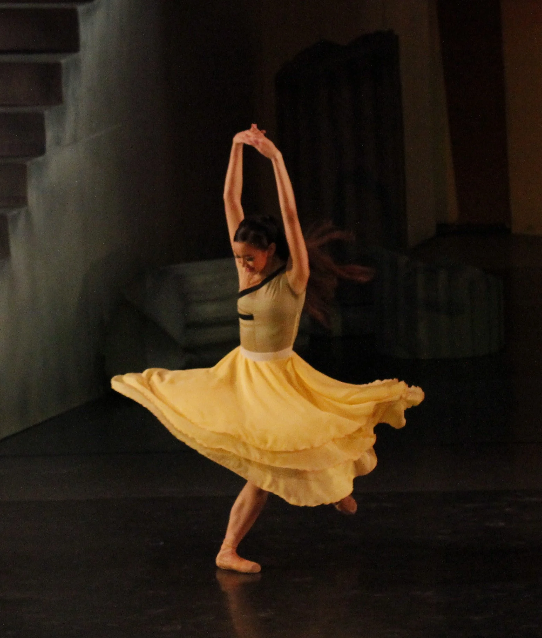    With her yellow skirt swirling around her like an inverted flower, Dawna Reign Mangahas portrays Corazon in Martin Lawrance’s  Rebel  (2016), a choreography partly inspired by the People Power Revolution of 1986. Yellow was the color most associat
