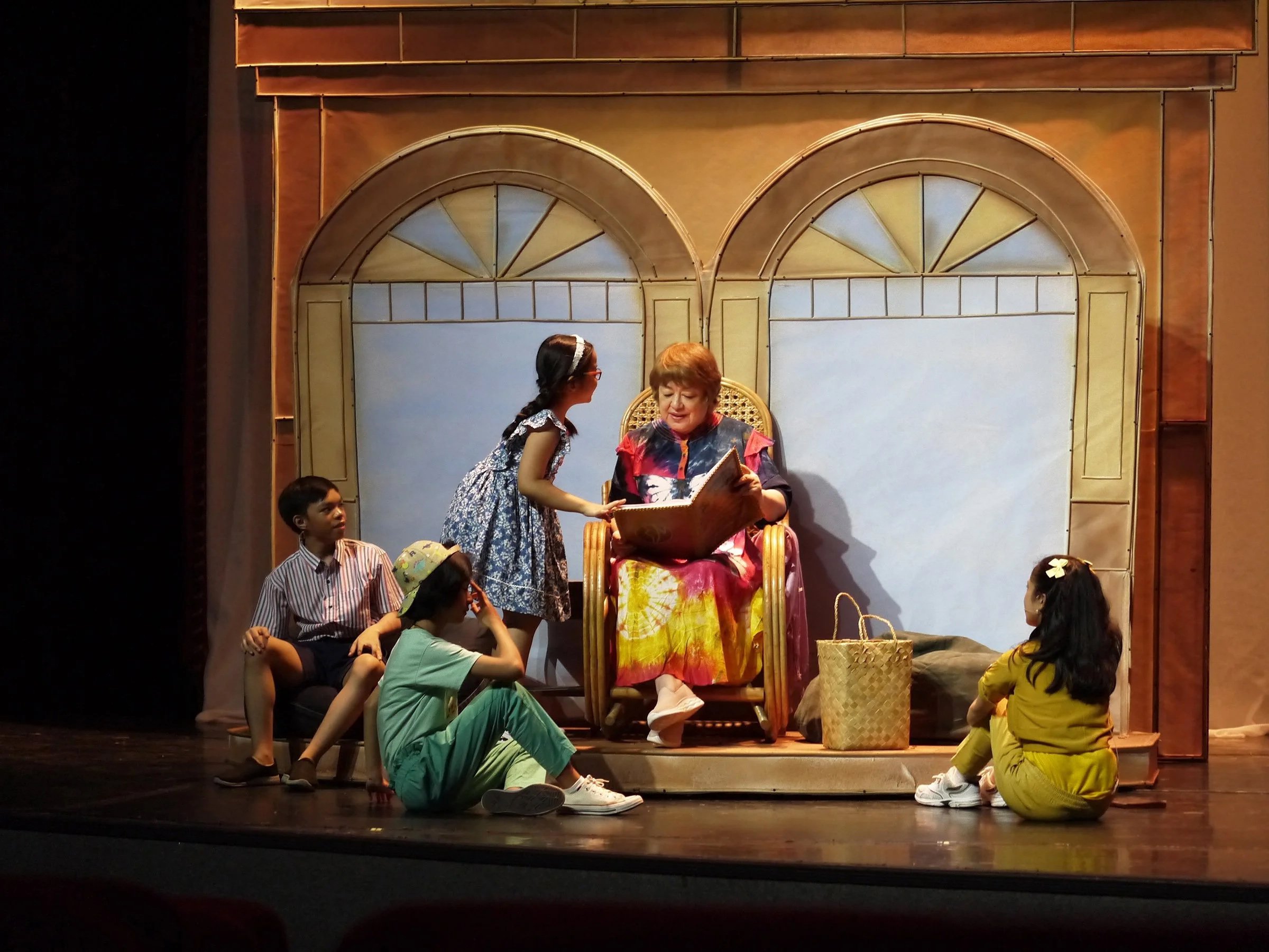    In Ballet Manila’s restaging of  Tatlong Kuwento ni Lola Basyang  (2024), Lola Basyang – the iconic storyteller of Philippine literature – gets a makeover. But even if the traditional baro’t saya has given way to a tie-dyed housedress and sneakers