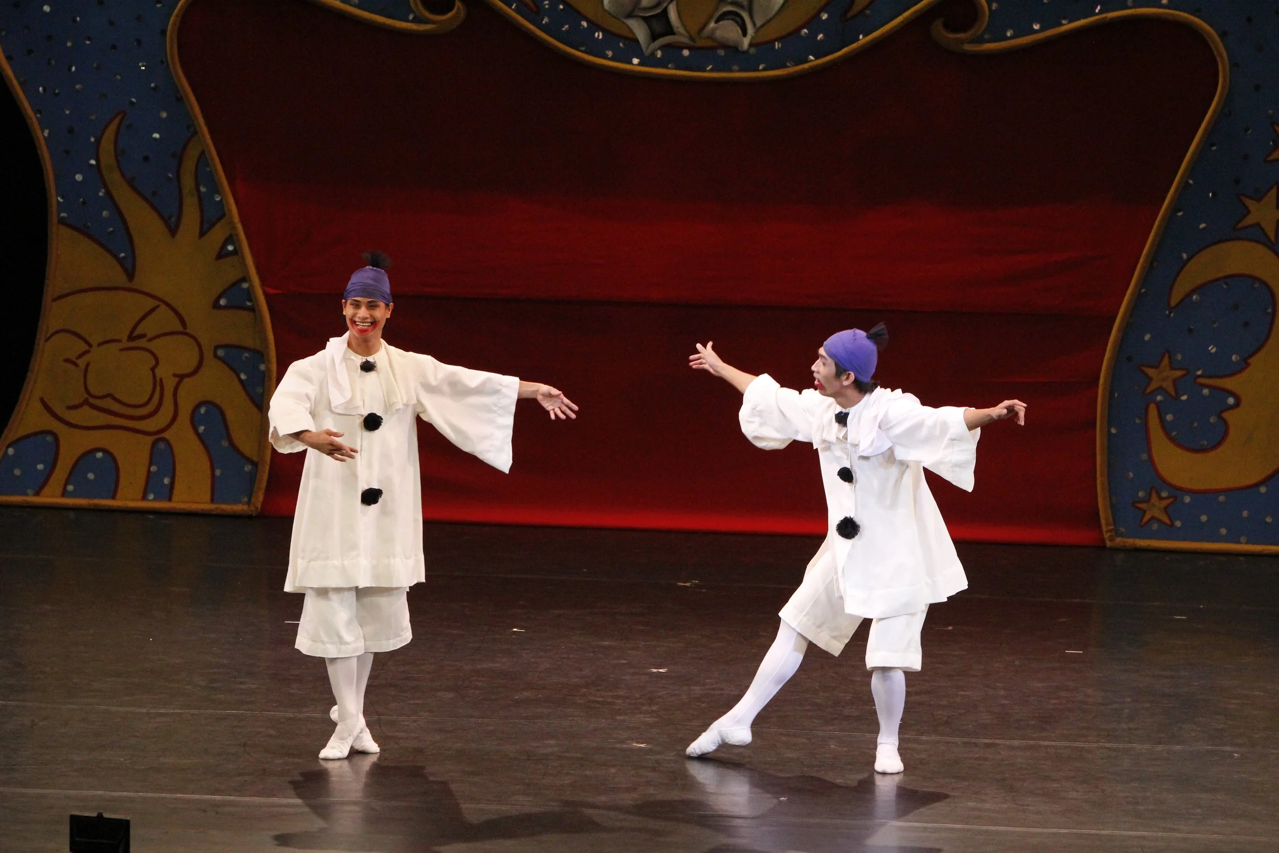    Though clad in identical white outfits, the happy clown (Alvin Santos, left) and the sad clown (Glenn Ragel) are actually opponents trying to outsmart each other in the  Fairy Doll  pas de trois, all in a bid to win the heart of the fairy doll pri