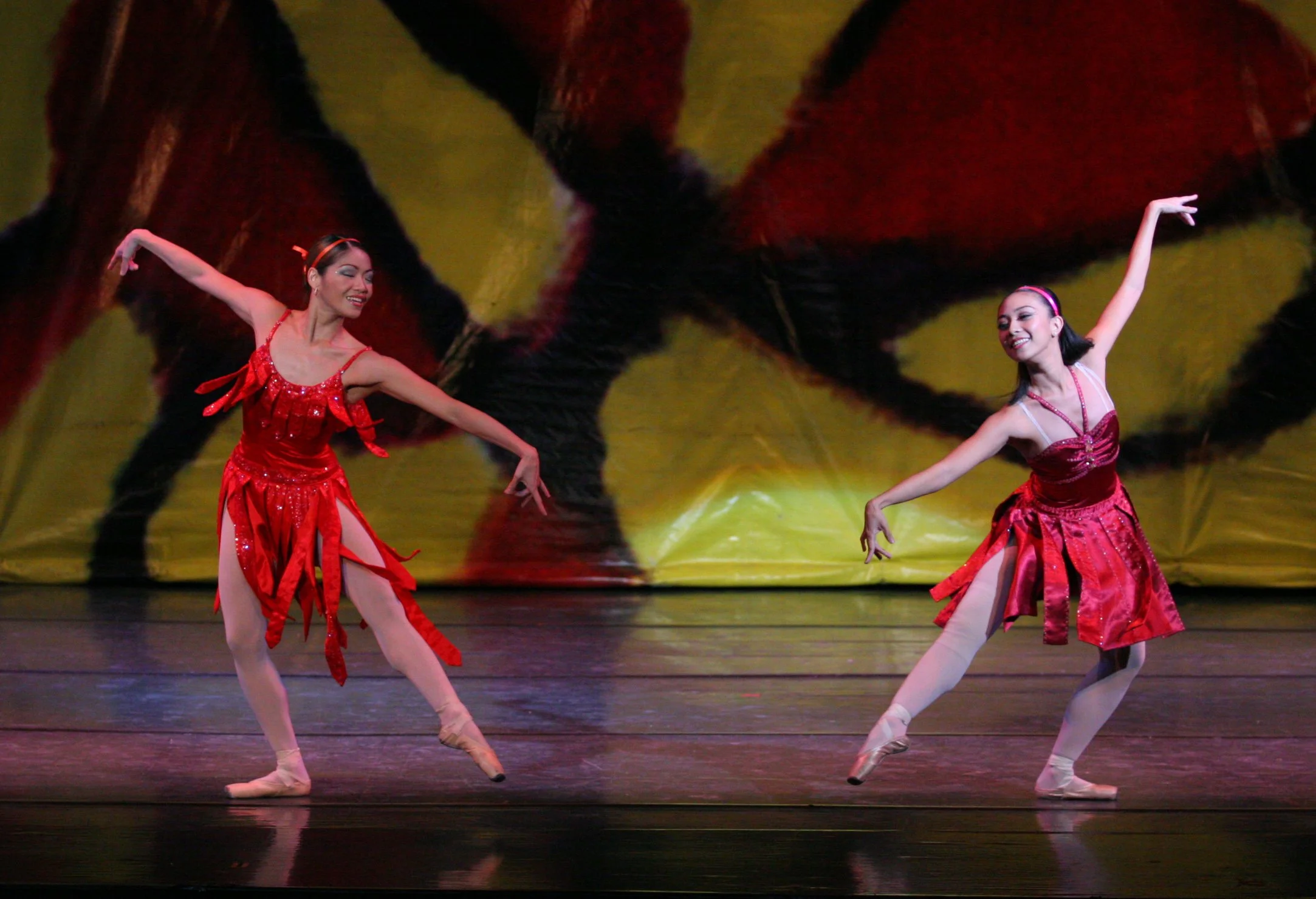    Complementing outfits in two shades of red are worn by Sandralynn Huang and Mylene Aggabao as they dance to the lilting melody of  Magandang Gabi.  The number is part of  Mga Awit at Sayaw,  a suite choreographed to familiar OPM songs which was pa