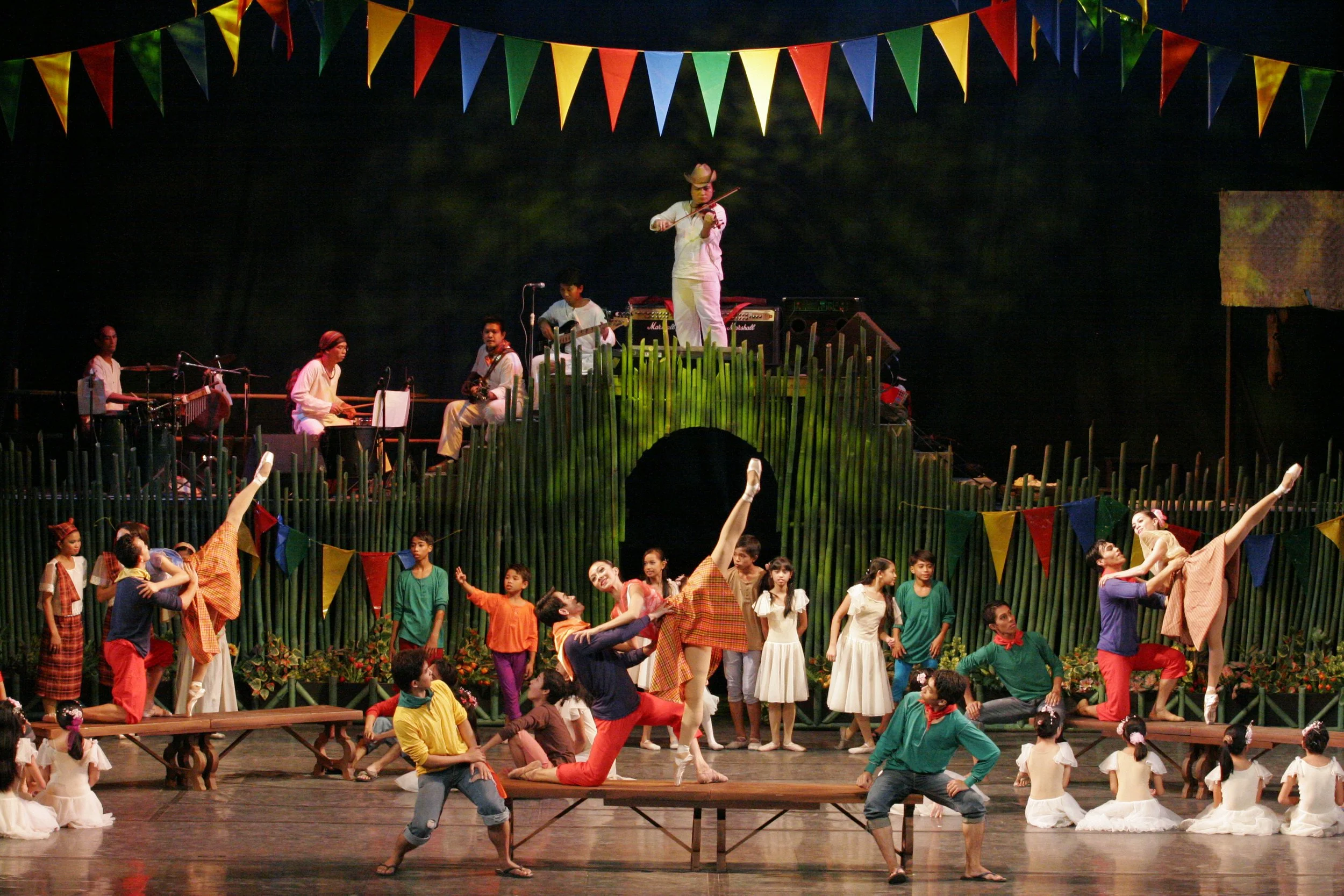    Jerome Espejo and Mylene Aggabao perform a pas de deux with a twist – the  sayaw sa bangko . This folk dance sees the couple performing on a narrow bench, moving from one end to the other, and even exchanging places in a remarkable show of balance