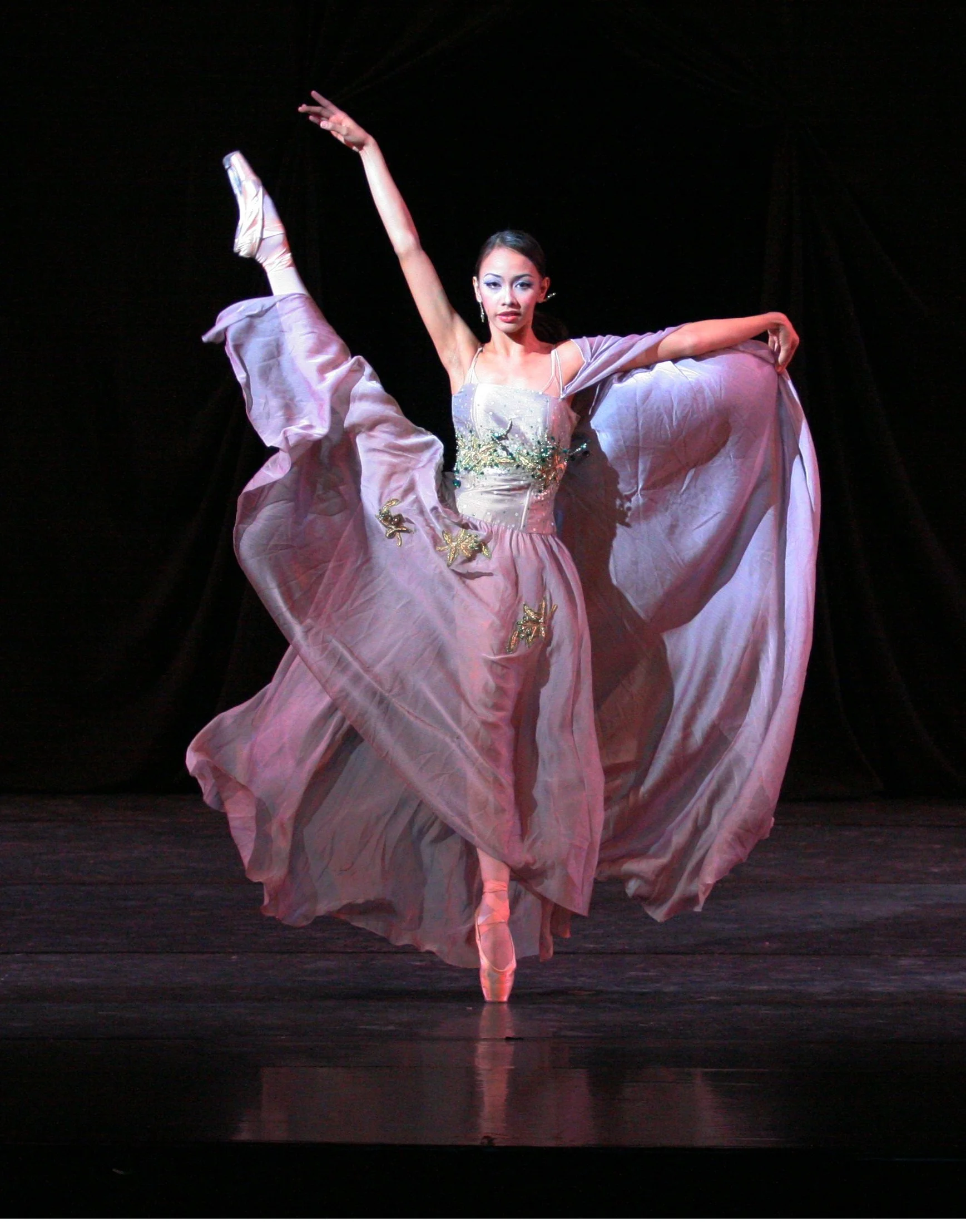    Fashion meets ballet in Tony Fabella’s  Dalagang Pilipina  where the ballerinas dance in gowns by designer Auggie Cordero. A range of colors are represented in the showcase, including this flowing one in lilac.  Dalagang Pilipina  premiered in  OP