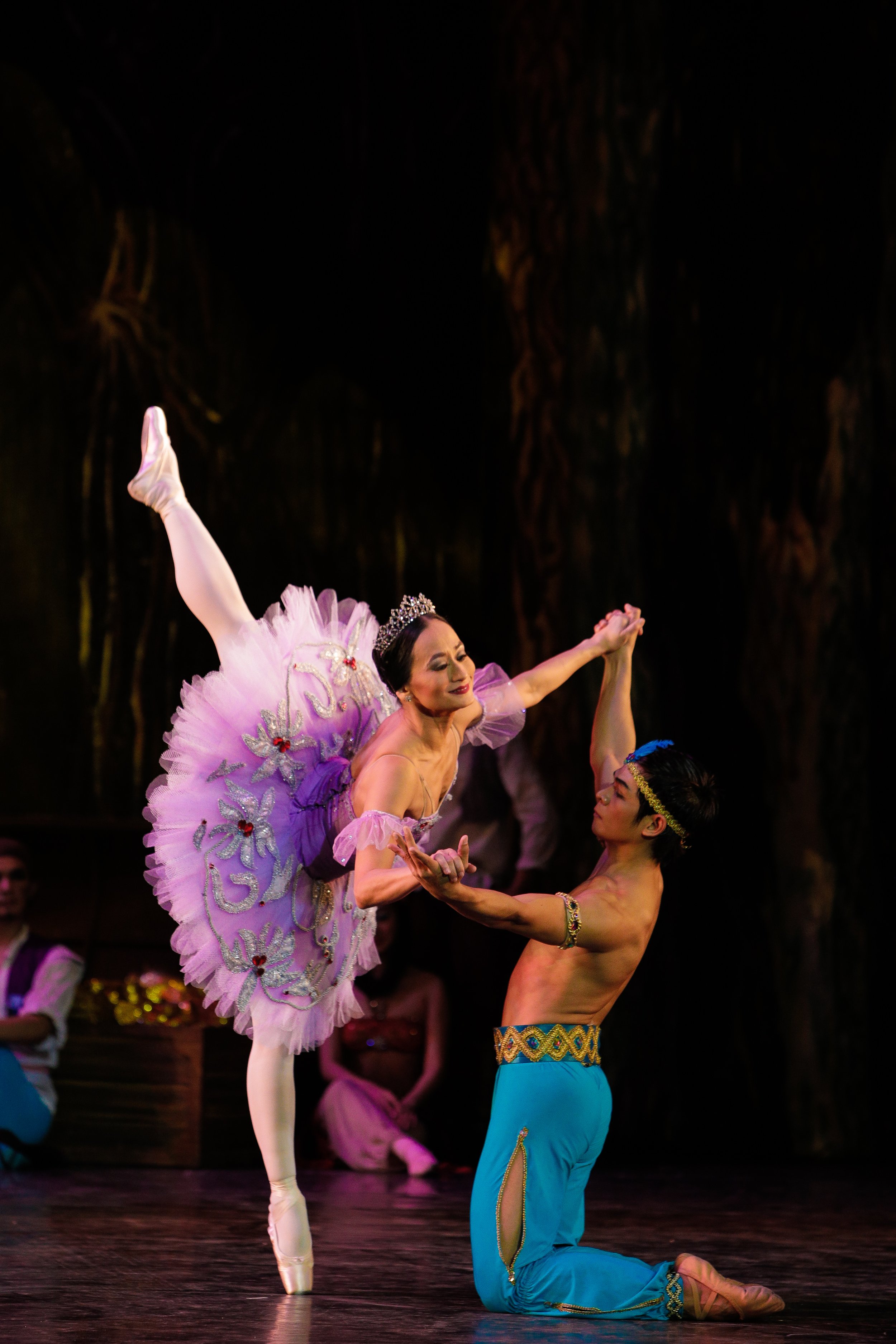    The lilac tutu of Medora serves as the delicate backdrop for silver floral embellishments that complement her crown in  Le Corsaire  (2013). In this scene from the pirate-themed ballet, she dances with Ali (Gerardo Francisco Jr.), the loyal servan
