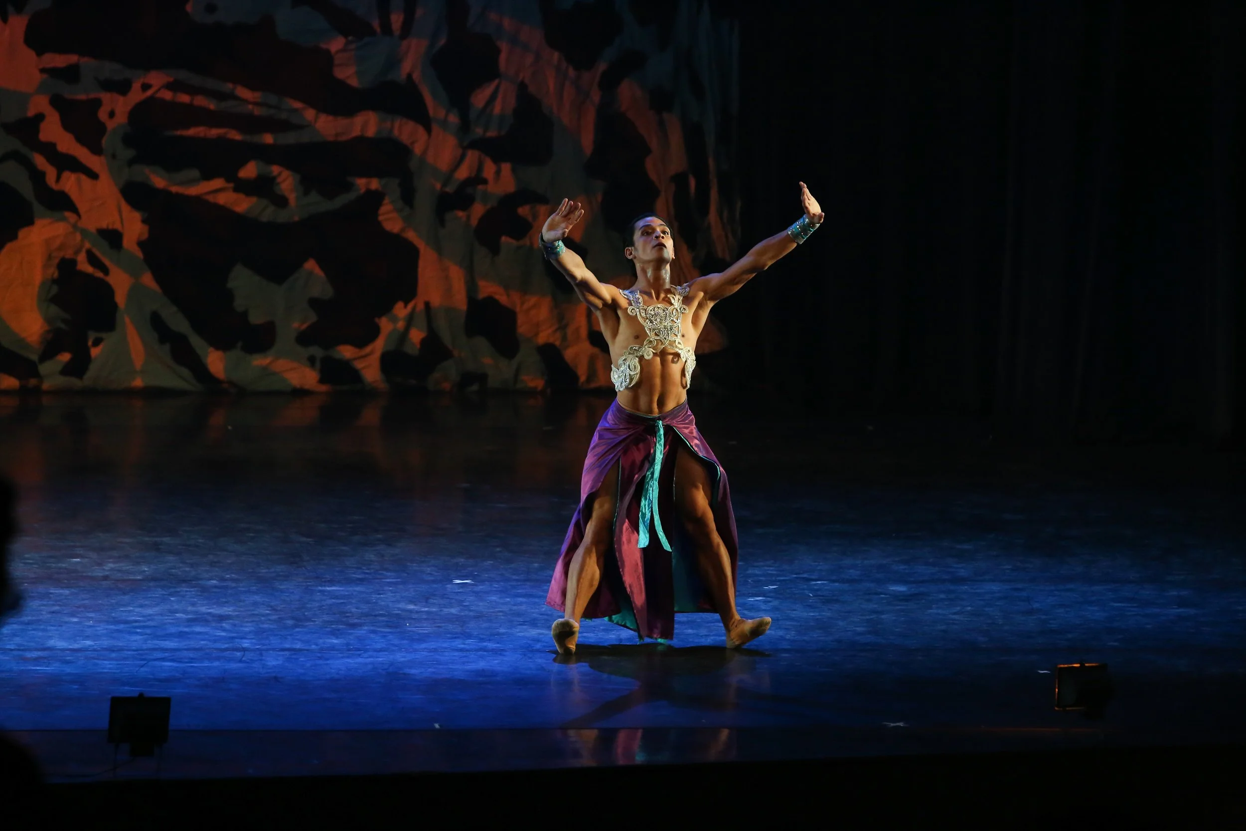    Garbed in a sarong in luxurious tones of purple and teal, Gerardo Francisco Jr. takes on the lead in Augustus Damian III’s all-male choreography  Aramica . It was one of the numbers showcased in  Deux  (2019). Photo by Erickson Dela Cruz   