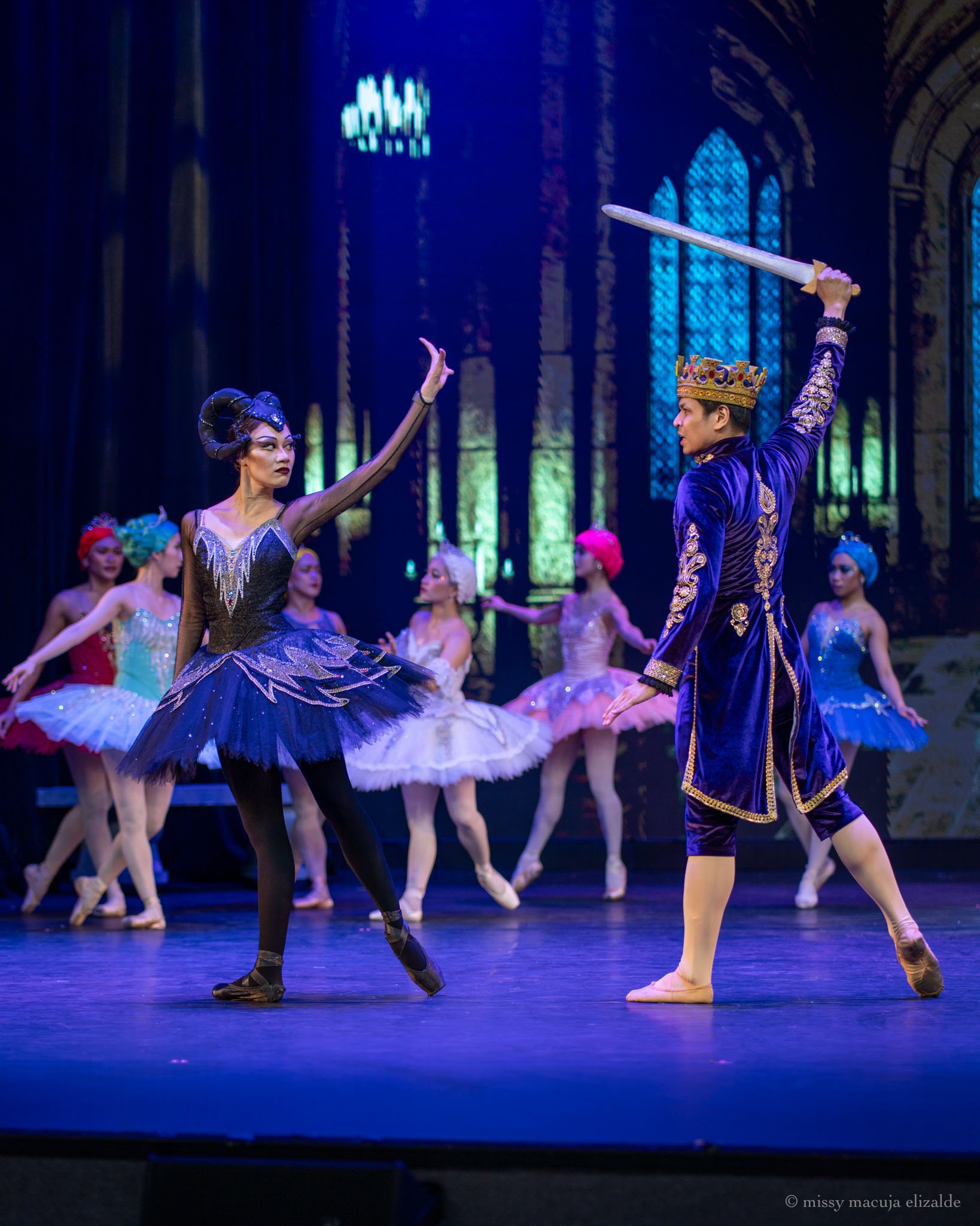    King Stefan (Mark Sumaylo) draws his sword as the vengeful Carabosse (Abigail Oliveiro) threatens to put a curse on his daughter, the newly born Princess Aurora in Lisa Macuja Elizalde’s  Sleeping Beauty  (2026). Photo by Missy Macuja Elizalde   