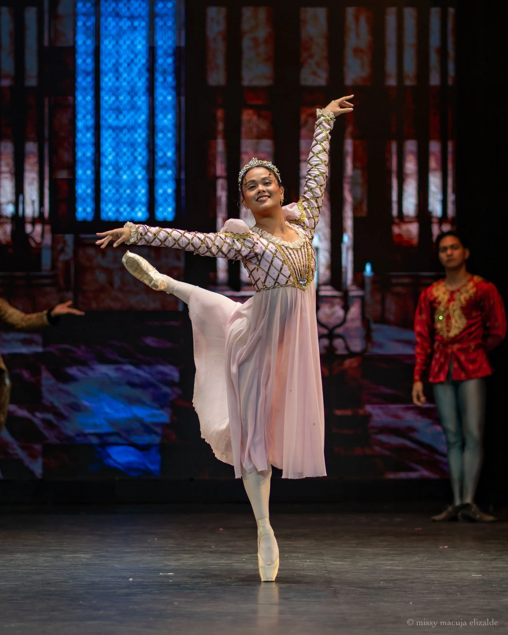    Her fervent wish to have a child has been granted, so of course Queen Leah (Rissa May Camaclang) is in a festive mood – and in her pink frock at that! The joyful scene comes from Lisa Macuja Elizalde’s  Sleeping Beauty  (2026), Ballet Manila’s pre