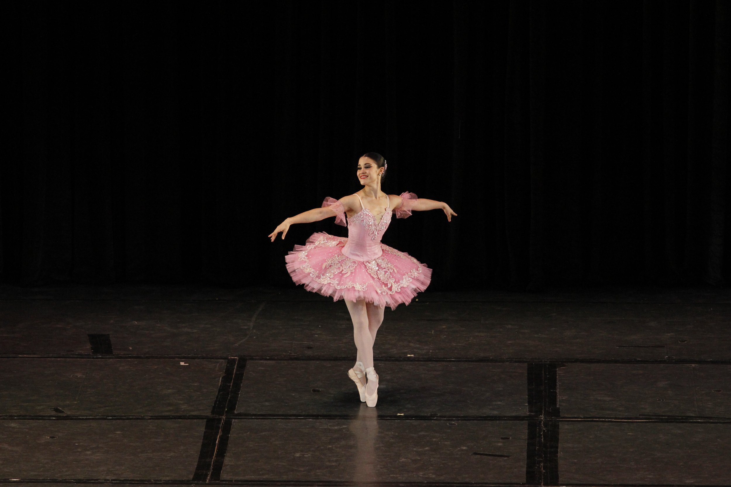    The Fairy Doll (Tiffany Chiang-Janolo) is the picture of beauty and charm as she flits across the stage in her pink tutu. No wonder, a pair of clowns – one happy, one sad – is fighting for her attention and affection in the  Fairy Doll Variation ,