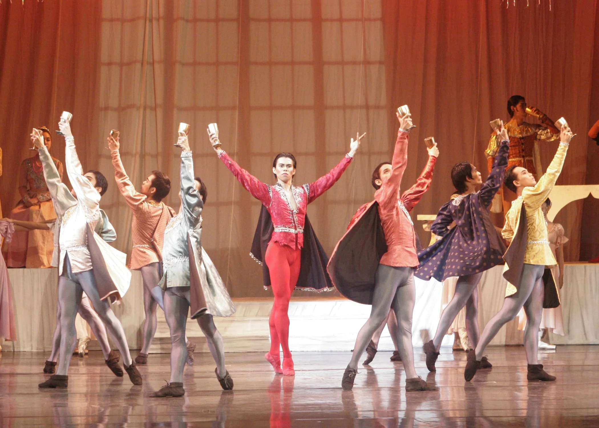    Francis Cascaño as Tybalt acts as the ringleader in this scene from Sergey Vikulov’s  Romeo and Juliet  (2007) set in the house of the Capulets. On this night of feasting, he marshals his cohorts into downing goblets of wine, unknowing that Romeo 