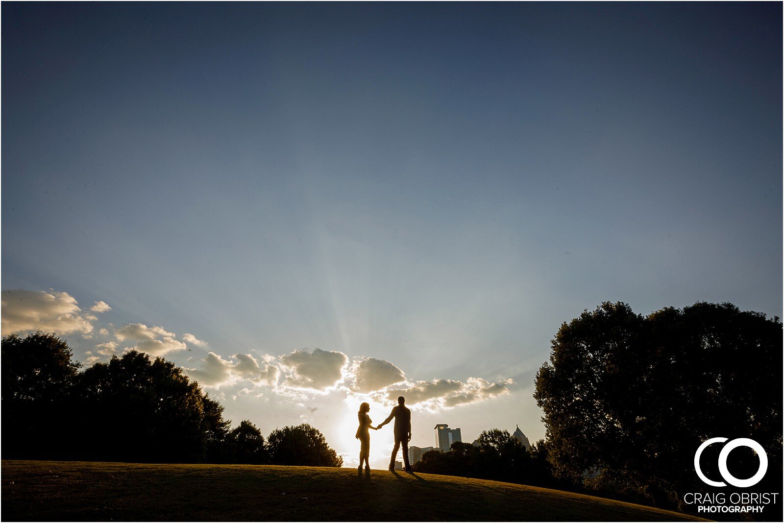 Piedmont Park Merecedes Benz Stadium Atlanta Skyline Enagagement Portraits_0011.jpg