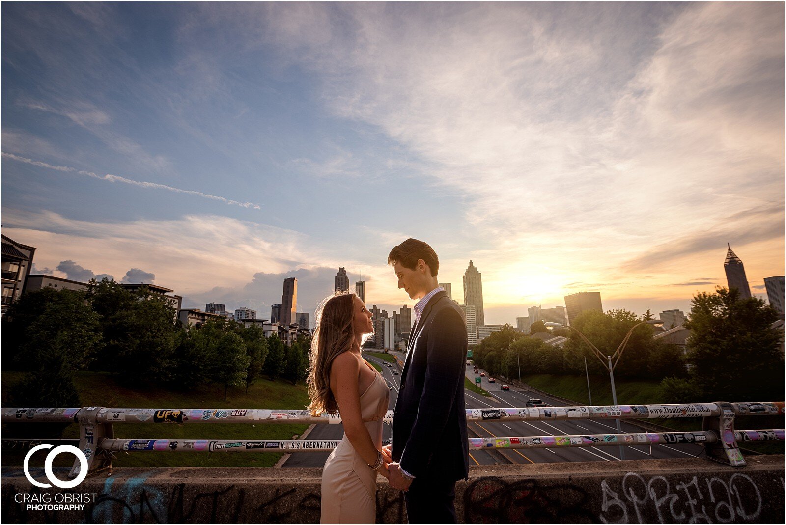 Ponce City Market Jackson Street Bridge Atlanta Skyline Engagement Portraits_0036.jpg